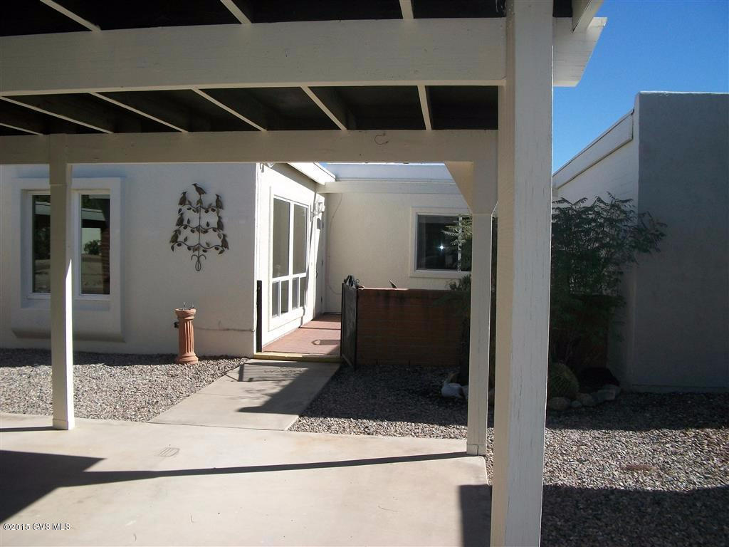 Wonderful mountain views from rear patio. Attractive front patio with patio furniture and water fountain. Many updates in home, very light & bright. Open concept. Landscaped common area to front & rear of home. 2 car carport. Ideal for snow birds. Steps to GVR pool. Floors updated with ceramic tile & stone. Kitchen windows replaced 2010. Outside painted 2013. Sky lights replaced 2011 Popcorn ceiling removed. bricked rear patio. Pomegranate & ruby red grapefruit tree. Both bathrooms updated. HVAC replaced. Home is fully furnished. Computers are excluded, also contents of all closets, pantry also. In entry wall picture & mirror cover wall cutout.