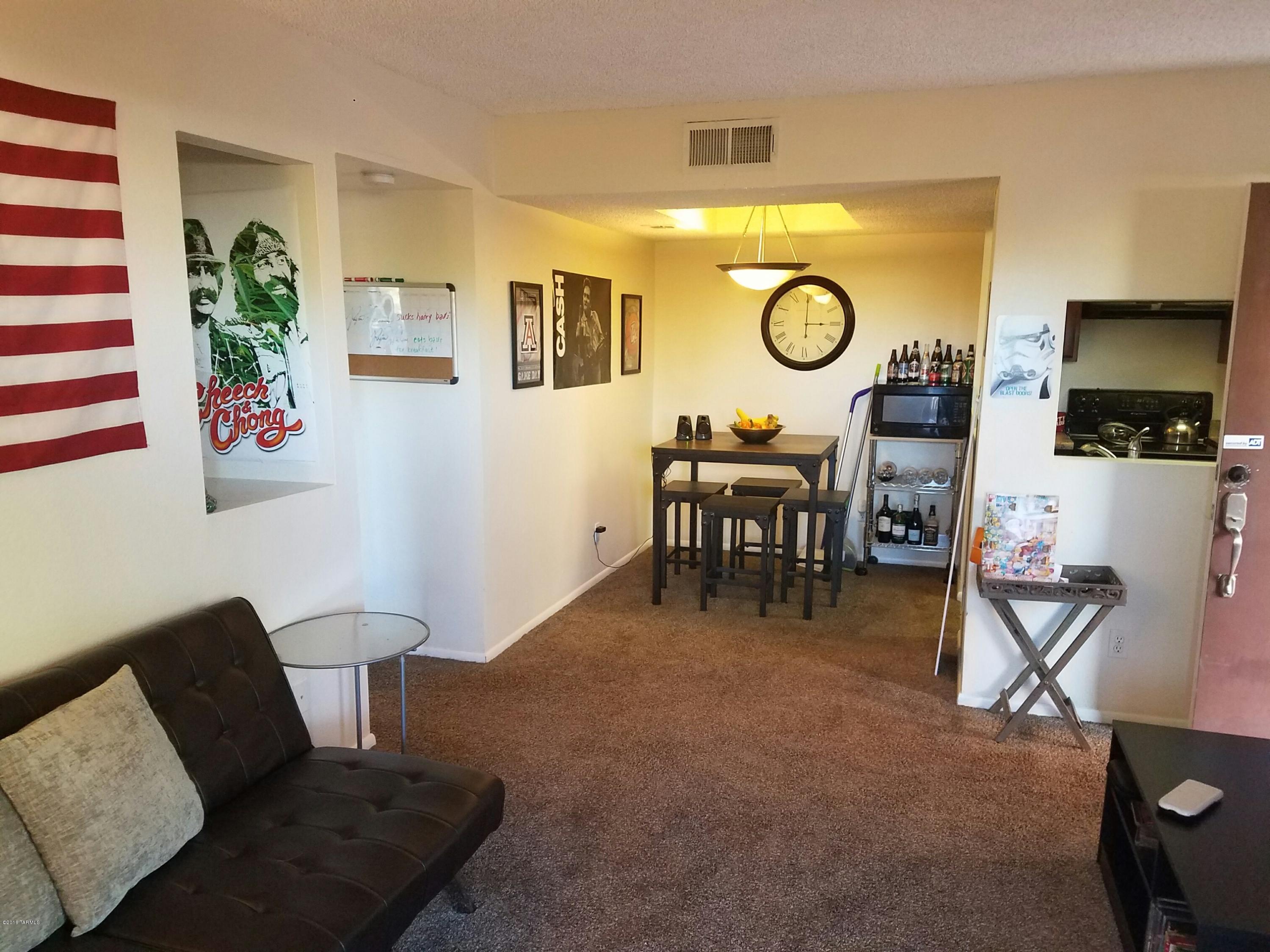 The Condo King presents popular Copper Star Condo! Located biking distance to the UofA, the modern street car, and walking distance to Cattran and Suntran. This light, bright, and open home is one of the only units with a backyard and is appointed with beautiful cherry color cabinets and black appliances. These condos have all the convenience of living in the heart of Tucson located on restaurant row with all the natural beauty the area has to offer.Resort-like amenities include:gated community,security cameras,pool,spa,basketball court,exercise room & clubhouse. Water and wifi is included in the HOA fee. These condos fit the fannie and freddie requirements and can get conventional financing.