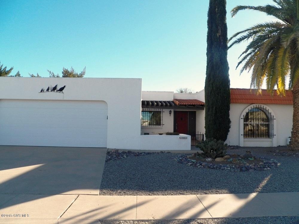 Lovingly updated over the years creating a very Southwestern 3BR 2BA home. Great attention to detail with custom copper cornice boards, valances and hardware on all doors and cabinets. Opening the kitchen to the living/dining area and adding a garden window over the sink. The great room has an electric corner fireplace. Next came a 12'x12' breakfast area and bar to welcome the morning sun and face the Santa Rita Mtns. New dual pane windows and patio doors installed throughout the home. Both bathrooms were remodeled featuring new raised vanities, light fixtures, mirrors. Tile floors and tile accents give a beautiful finished look. The covered rear patio offers privacy, wonderful mountain views and faces natural desert arroyo. Just across the street to the Desert Meadows rec  facility/pool. Most of the furniture is available SBOS.