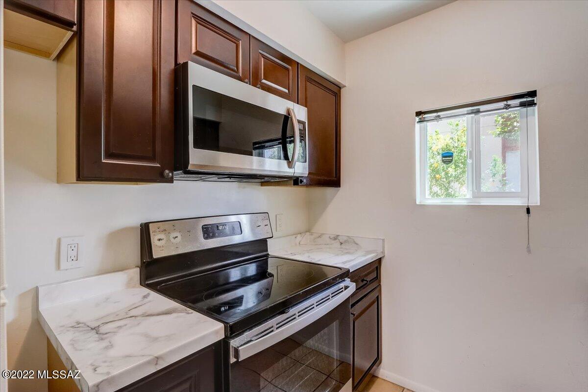 Welcome home to this wonderful lower level (no stairs) 2 bedroom & 1 bathroom condominium. With easy access to shopping, bus lines, medical, restaurants and schools, don't miss out on this updated home. Oversized Jack & Jill bathroom has access from the primary bedroom and hallway. Plenty of storage inside and a nice shaded covered patio is accessible through the primary bedroom and family room. Spend the hot summer days enjoying the community pool and BBQ areas. Covered space #114.