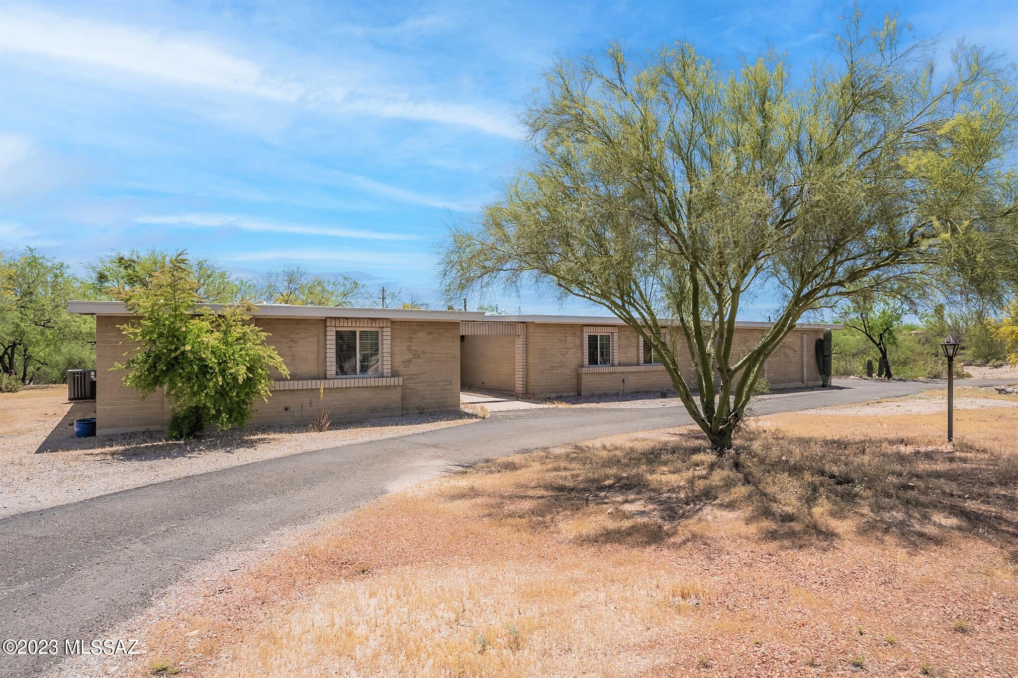 NEW PRICE. Updated, Single Story, 5Bd, 4BA, 2,905 Sqft home in central Oracle Height Estates. Lives large with split bedroom areas, generous common living spaces, could work well for multigenerational family purposes or multiple in-home offices. Kitchen remodeled, neutral gray palette, gas stove, new luxury vinyl & carpet, bathroom updates, new ceiling fans, window coverings. Fireplace off walkout dining area. Private 1.29 acre lot backs up to green space. Circular driveway. Large 2 car garage with shop or extra storage, outdoor shed. Room for RV. 1 HVAC replaced and Roof recoated, new Water Heater. Pre-Inspected. Convenient to Ina and Oracle, close to many shopping amenities, restaurants, medical facilities, easy access to downtown, UA, Pima College, I-10.