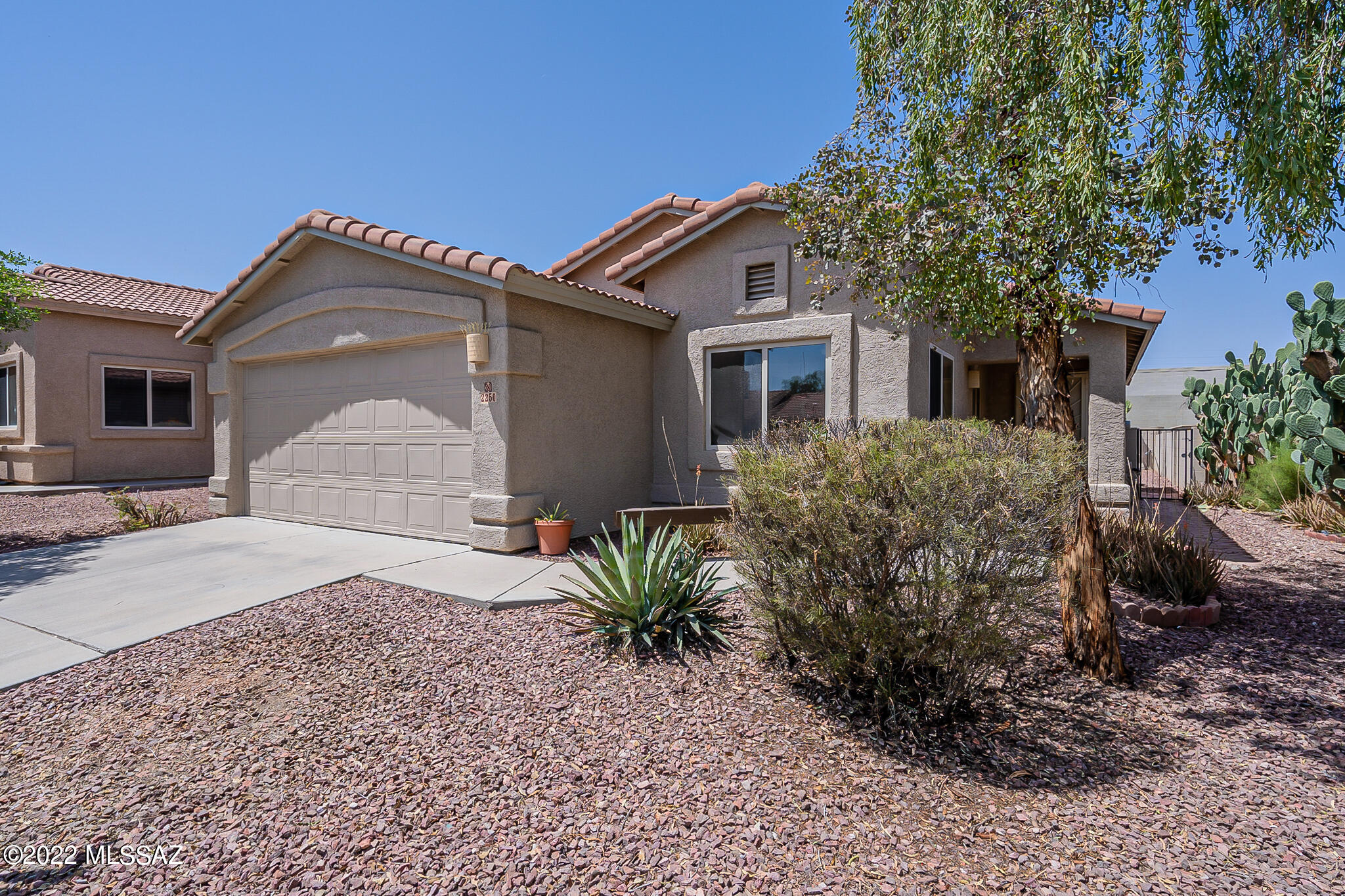 This 3 bedroom, 2 bath home is freshly painted and ready to enjoy. Easy care landscape with a very private back yard. There is a bright eat in kitchen space and a large great room that opens into back yard. No carpet in the home. Large laundry room for extra storage and 2 car garage. The location of this community is close to downtown, the UofA, I-10, and Saguaro National Park.