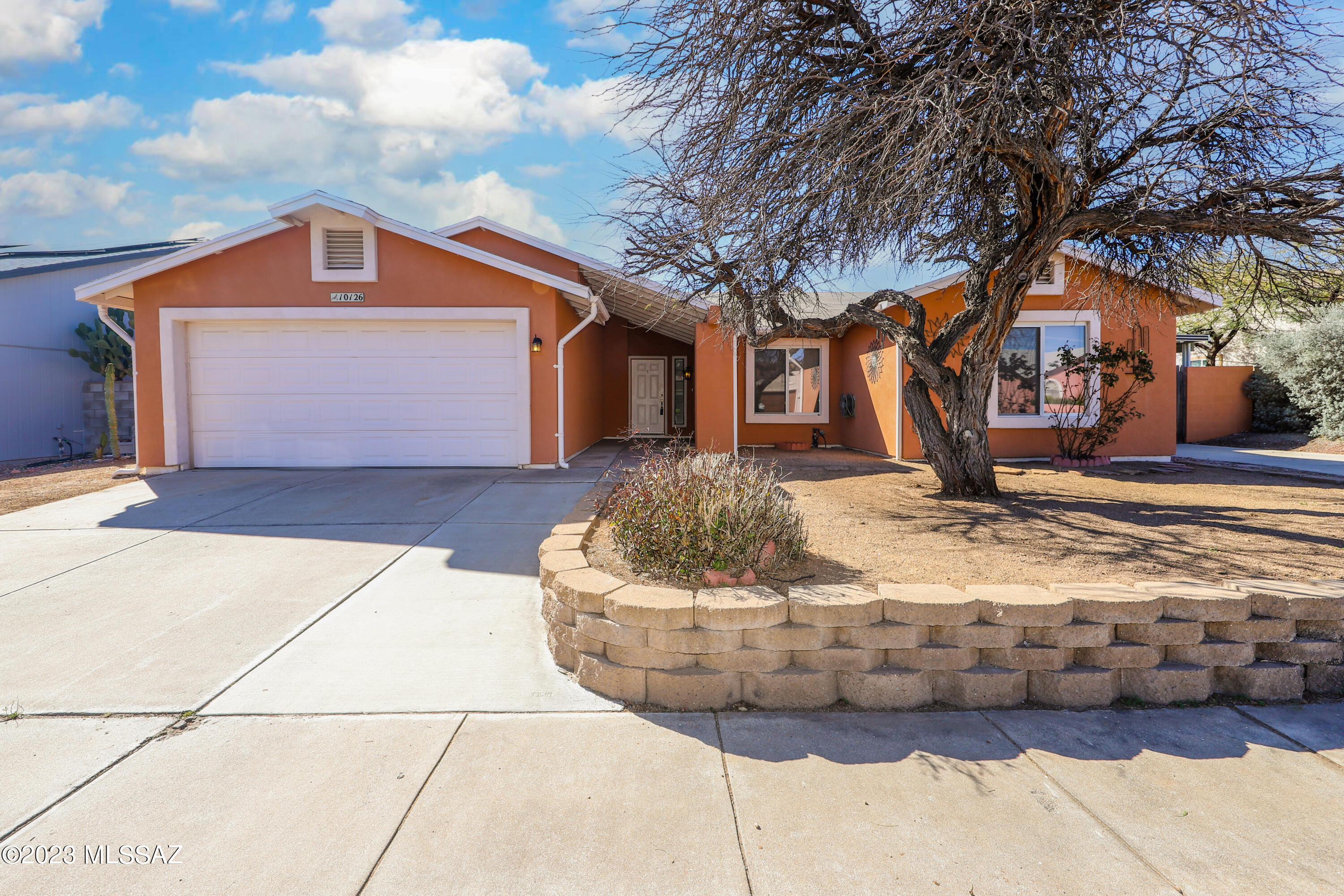 Have you been waiting for an affordable 4br/2ba home on Tucson's east side?  Wait no longer!  Located in the Rancho Del Rincon subdivision, this gem is ready for a new owner and move in ready.  Inside features an open floor plan with tile throughout the kitchen, living room, and most high traffic areas.  Fridge, washer, and dryer all included to minimize out of pocket expenses.  Keep your monthly electric down with your solar system that will be OWNED not leased.  NO HOA so bring your toys with plenty of parking and storage space from front to back.  Backyard has over 50ft of covered patio, plus an entire side yard covered perfect for boat or camper storage, with plenty of room left over to work on projects.  Large workshop, and storage shed also included for keeping your items organized a nd out of the elements.  Come see for yourself!