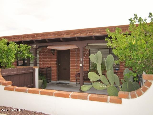 One of the nicest units on the market--cute as a button and all updated! Lots of TLC. Bathroom has a modern tiled walk-in shower, with handicap grabs and no tub. Updated kitchen has full-sized appliances, complete with an electric stove, and a great kitchen breakfast bar with more storage. You'll appreciate the storage shed with a GE stacked washer/dryer, new about a year ago, and the extra storage it provides, too! Freshly painted in neutral colors, and tiled throughout. Parking is conveniently right in front. Don't miss out. You will want to see this one, for sure! Furnished nicely, per inventory.