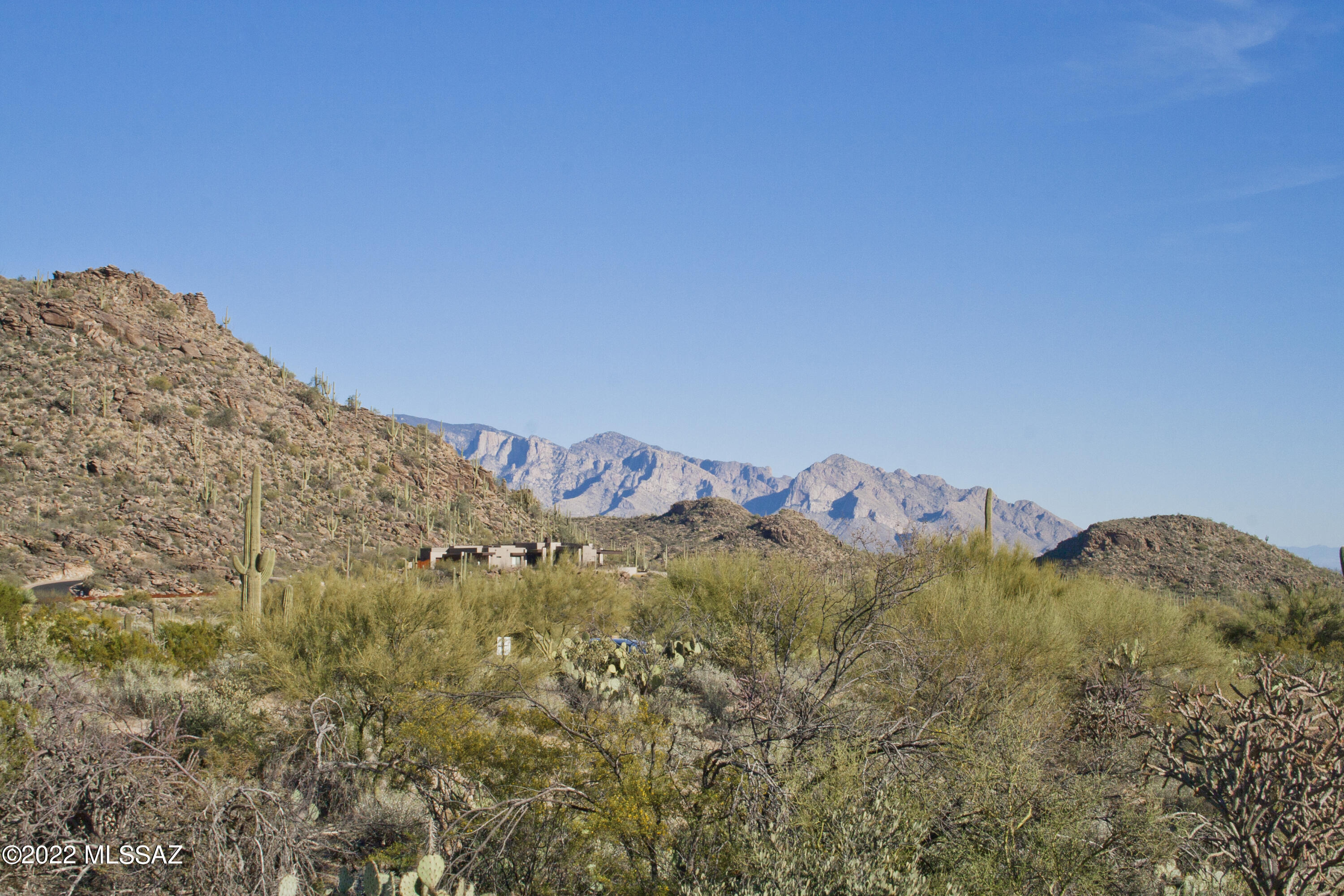 Simply stunning 2.13 acre Canyon Pass lot in the Dove Mountain area that offers amazing panoramic views! This property is one of the relatively few Canyon Pass custom lots that has Catalina Mountain views, dramatic vistas of downtown Tucson city lights, and multiple scenic views of the nearby boulder-strewn Tortolita Mountains too. The over 2 acre lot size and wash to the west provide excellent privacy as well. The gently sloping terrain means there is relatively minimal site preparation necessary, particularly relatively to many other lots in Canyon Pass. All of this in the flourishing Dove Mountain community with nearby golf courses such as The Gallery & Dove Mtn. Golf Club! You'll also find nearby hiking trails throughout the vicinity.