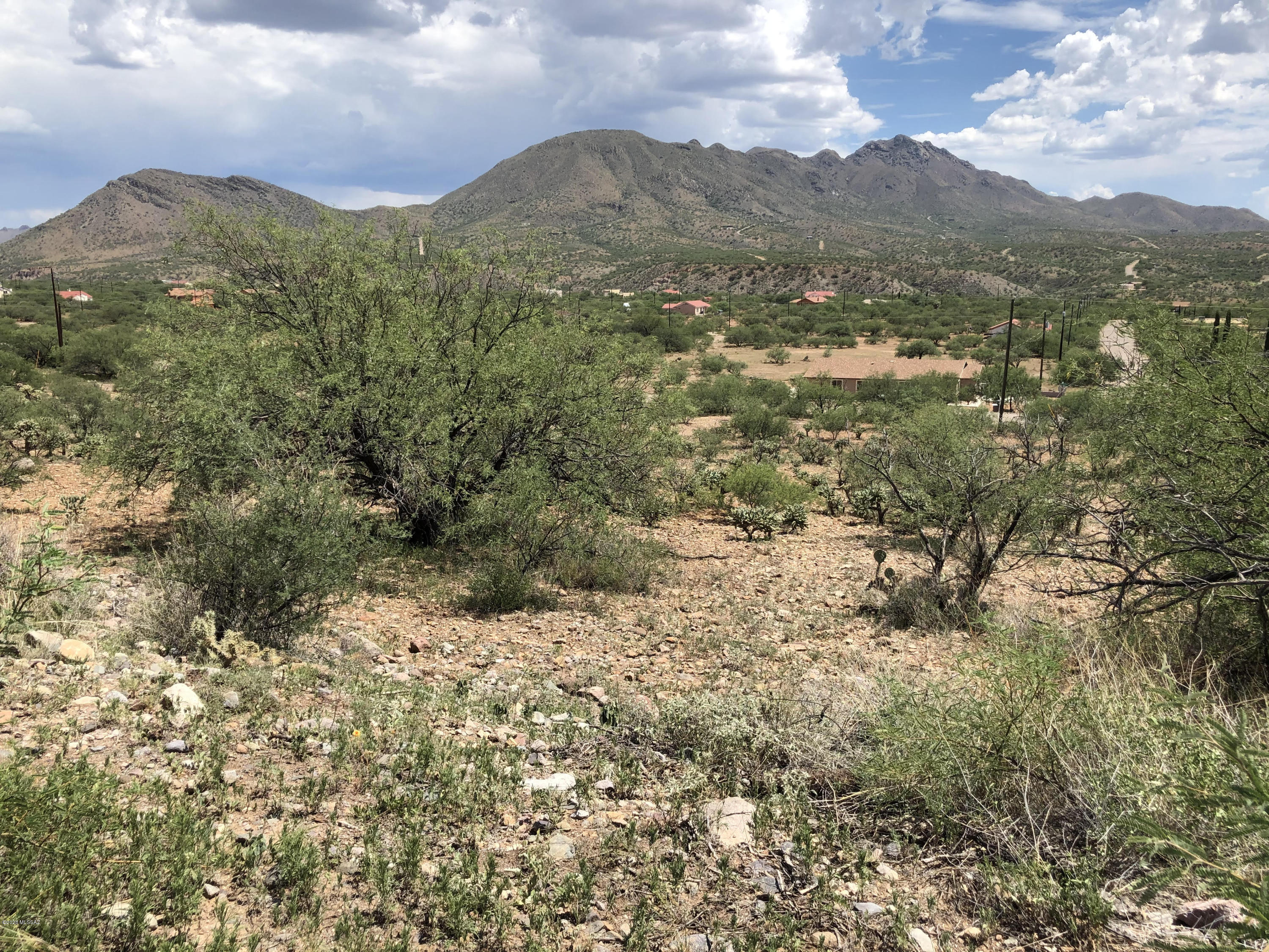 Nice view lot to build a home on, all paved access to I-19 about 8 minutes away.  Lot is served by electric, water and sewer at the street.