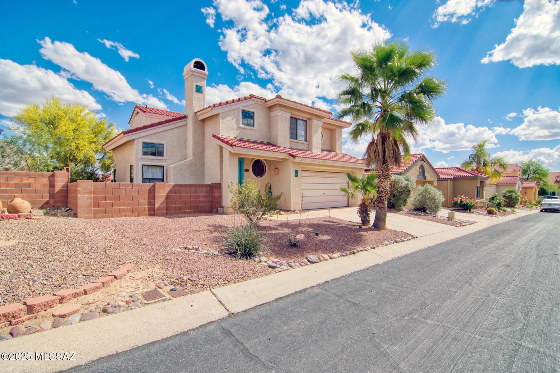 If you're looking for a contemporary style home in the heart of Oro Valley, this 2 story 4 bedroom home features breathtaking views of Pusch Ridge!!

Downstairs find a bright and inviting setting, with vaulted ceilings, saltillo tile, wood burning fireplace & separate dining area. Upstairs find the primary bedroom suite & 3 bedrooms with hallway bathroom.

Combination kitchen & family room includes a breakfast bar, fireplace, powder room & sliding glass doors opening to the patio.

This low maintenance home allows more time to enjoy the community amenities including swimming pool, spa, & walking trails. It's just minutes away from Canada del Oro Riverfront park including tennis, soccer fields, pickleball, and connects to the Loop trail. Conveniently located to shopping & restaurants