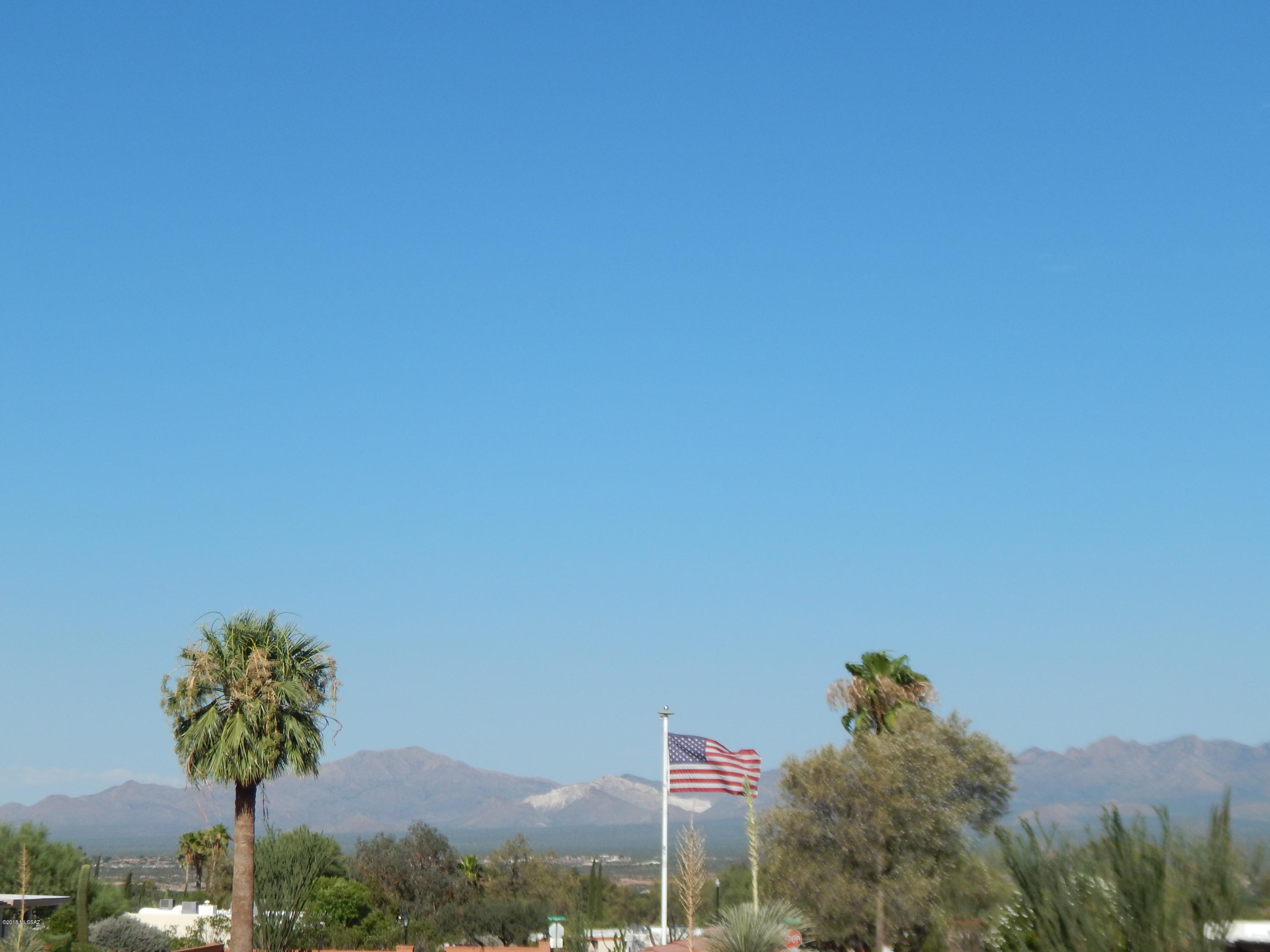 A DESERT GEM! Your search is over. This home will be open for viewing from 12:00-3:00 on Fri 6/29 and Sun 7/1. ONLY. All written offers will be reviewed by Seller on Tues 7/3 and the Seller will respond by 5:00 p.m.     Mountain Views galore, double carport, fireplace, on demand hot water, dual pane windows, tile throughout. Bonus AZ. room is not included in sq. ft.