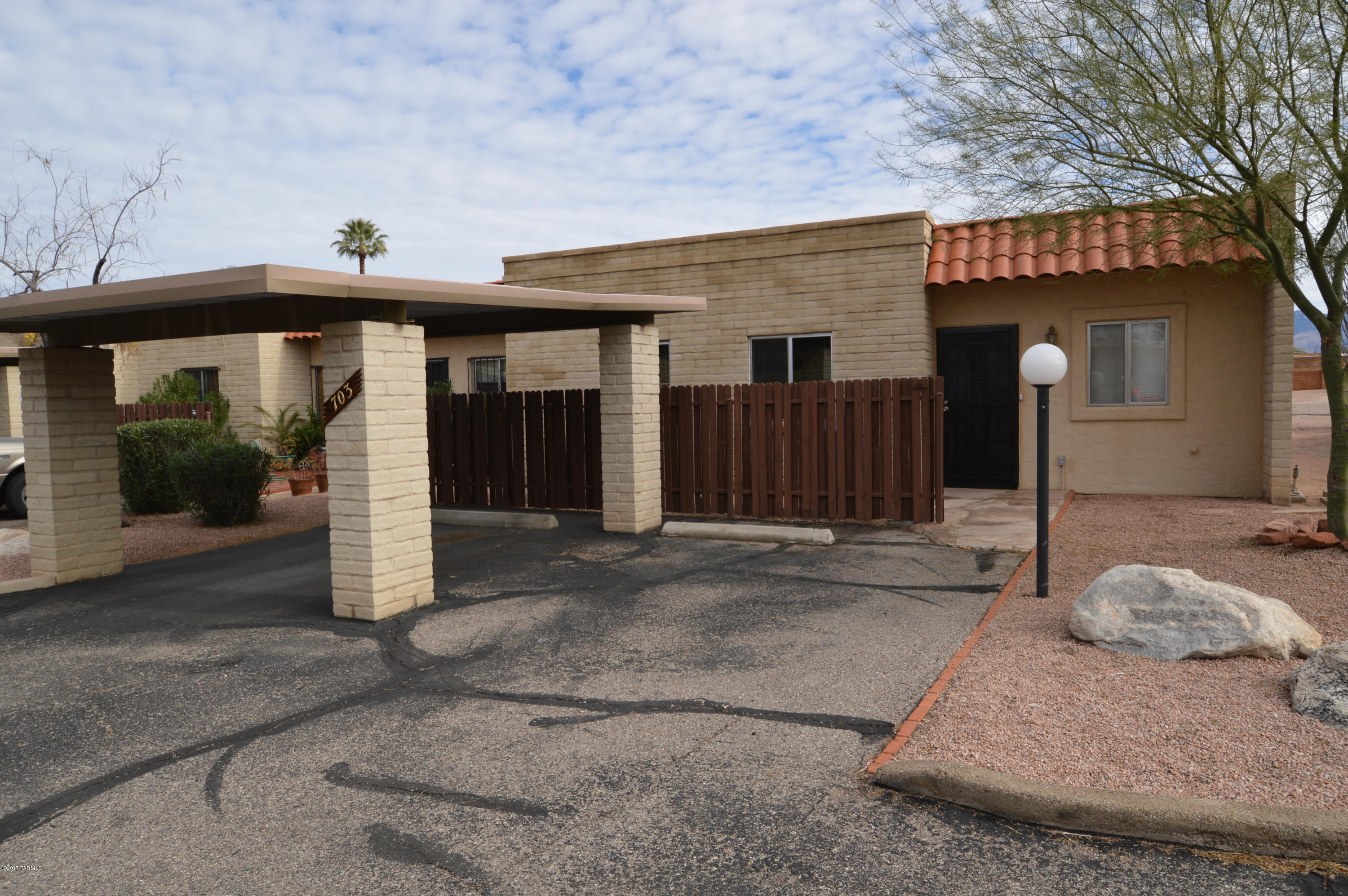 Impeccable condition. Large end unit 3 bedroom, 2 bath in quiet community. Close to schools, shopping and transportation. Just a short walk out the back gate to the pool and tennis court. Gorgeous, low care ceramic tile in all living areas, bedrooms luxuriously carpeted. Efficient heat pump for comfort and economy. HUGE master suite with His & Hers closets. Spacious, open and bright. Washer/dryer included. Affordable Sahuaro High School area! This one wont last long....SO CALL NOW!!