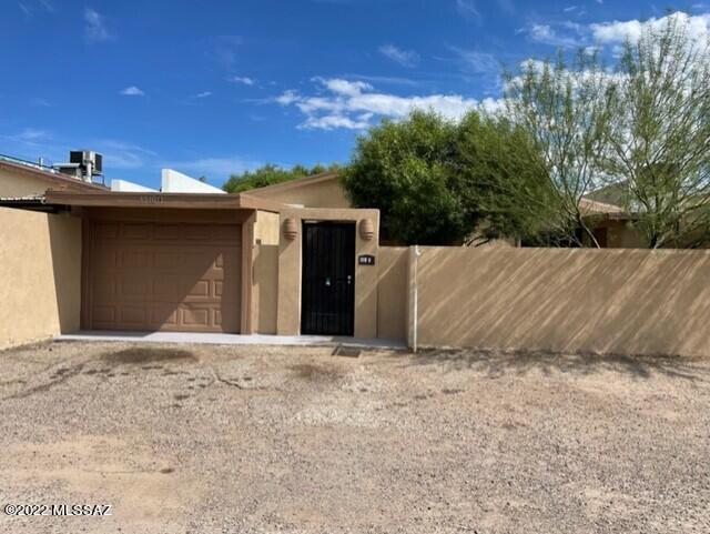 GREAT LOCATION in the KENNEDY PARK Neighborhood ADJACENT to the PARK and LAKE and Priced UNDER $200K. You'll find a Nicely UPDATED Home with a PRIVATE Lot that is WALKING DISTANCE to Kennedy LAKE!!! This ''Light & Bright'' SINGLE STORY Home has 3 BDs, 2 BAs, 1 Car Garage, & PLENTY of Guest Parking. This home has the GREAT ROOM Concept with a SPACIOUS Kitchen with Plenty of Cabinetry and a REFRIGERATOR that conveys (Oven/Stove is BRAND NEW).  Stainless Steel Appliances!  New carpeting and Ceramic Tile and NO Interior Steps!  Very Private Gated COURTYARD!  Close to shopping, restaurants, the FREEWAY, & just about EVERYTHING ELSE Tucson has to offer. AND NO HOA! WELCOME HOME!