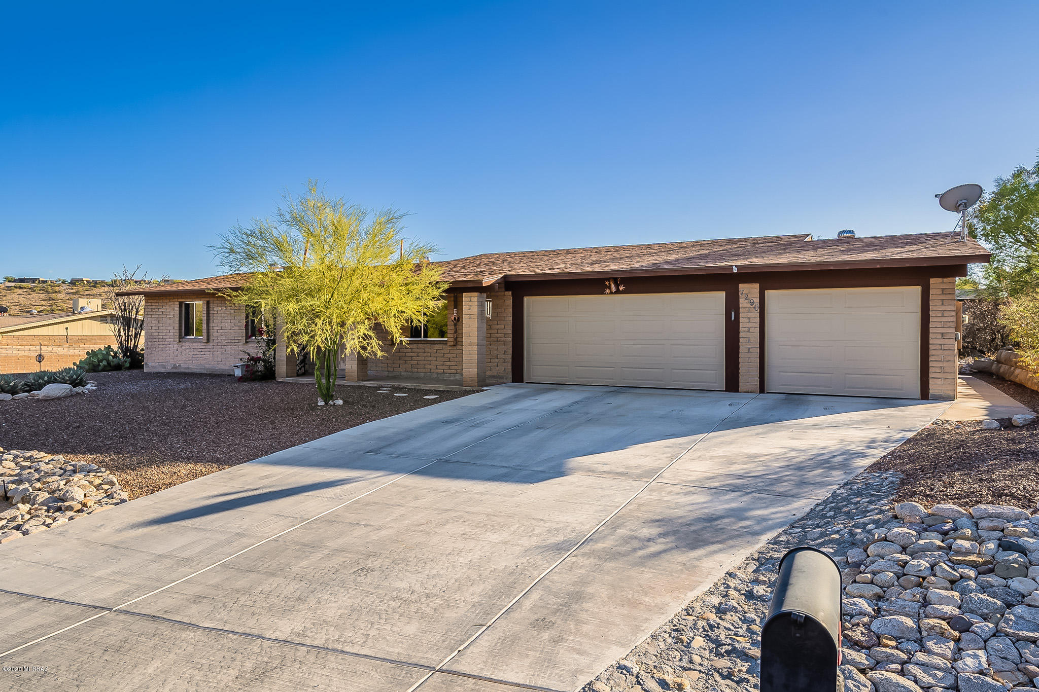 This beautiful 3 bd/2ba brick ranch style home checks every box. Located in the Northeast Sabino area you will have amazing mountain views, an extended driveway to your three car garage, and low care desert landscaping. Inside, the kitchen has recently been updated with beautiful quartz counter tops, granite composite sink,  and custom made cabinets. It also offers a large living room, family room, and office.   It is close to Sabino Canyon where you can hike, bike, or take a stroll. Also close to shopping and dining.  Come take a look at this beauty.