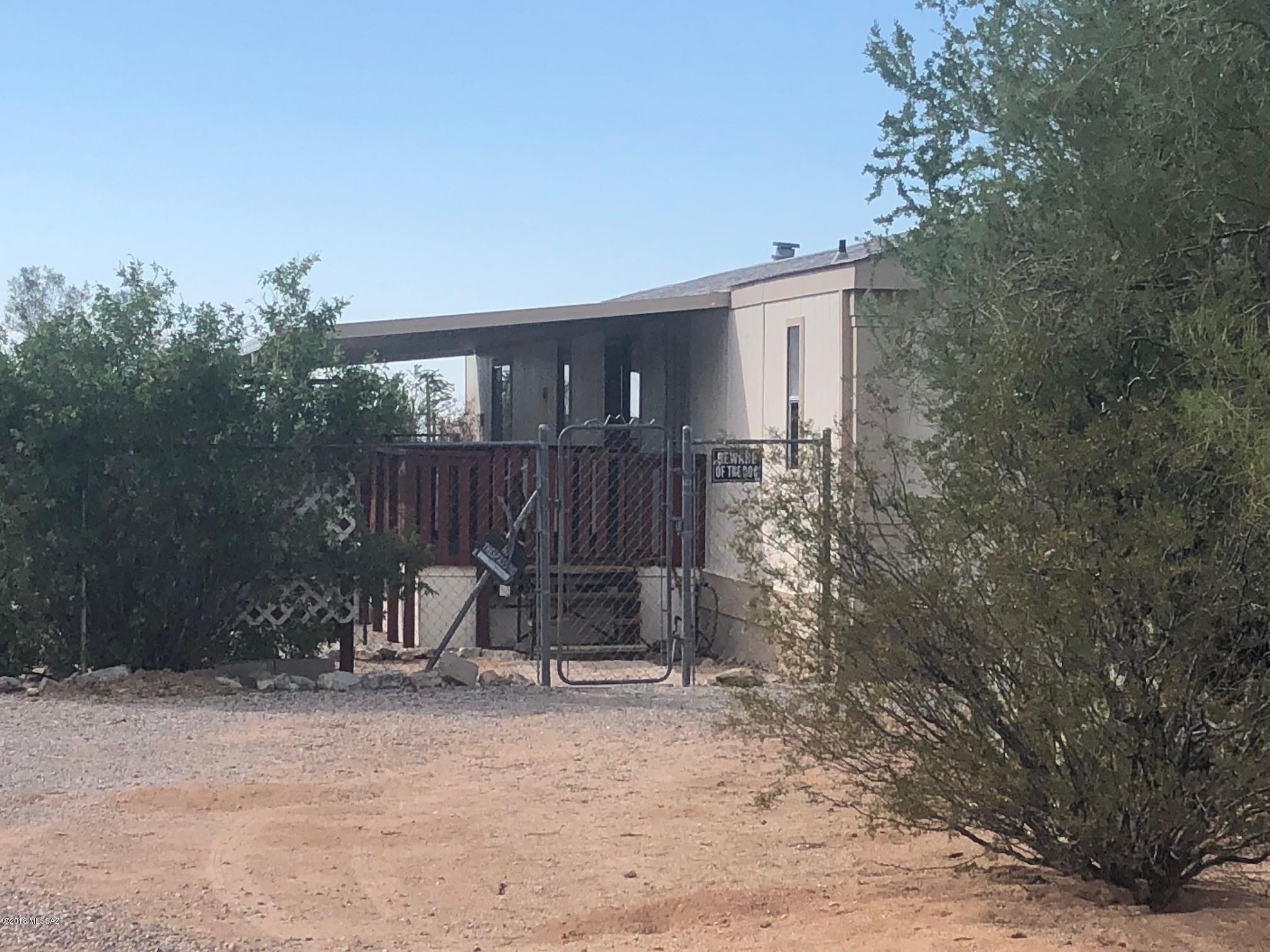 Tired of the hustle and bustle of city life? Houses one on top of the other? Check THIS out! Located on one acre, this partially fenced property features 3 bedrooms, 2 bathrooms, and a nice open floor plan. No carpet to be found. The kitchen has a gas stove, tile counter tops and has an open pass through to the great room. Spacious Deck off of the living area. Washer and dryer included. Spacious shed for your tools. 2 well behaved pets are welcome!!