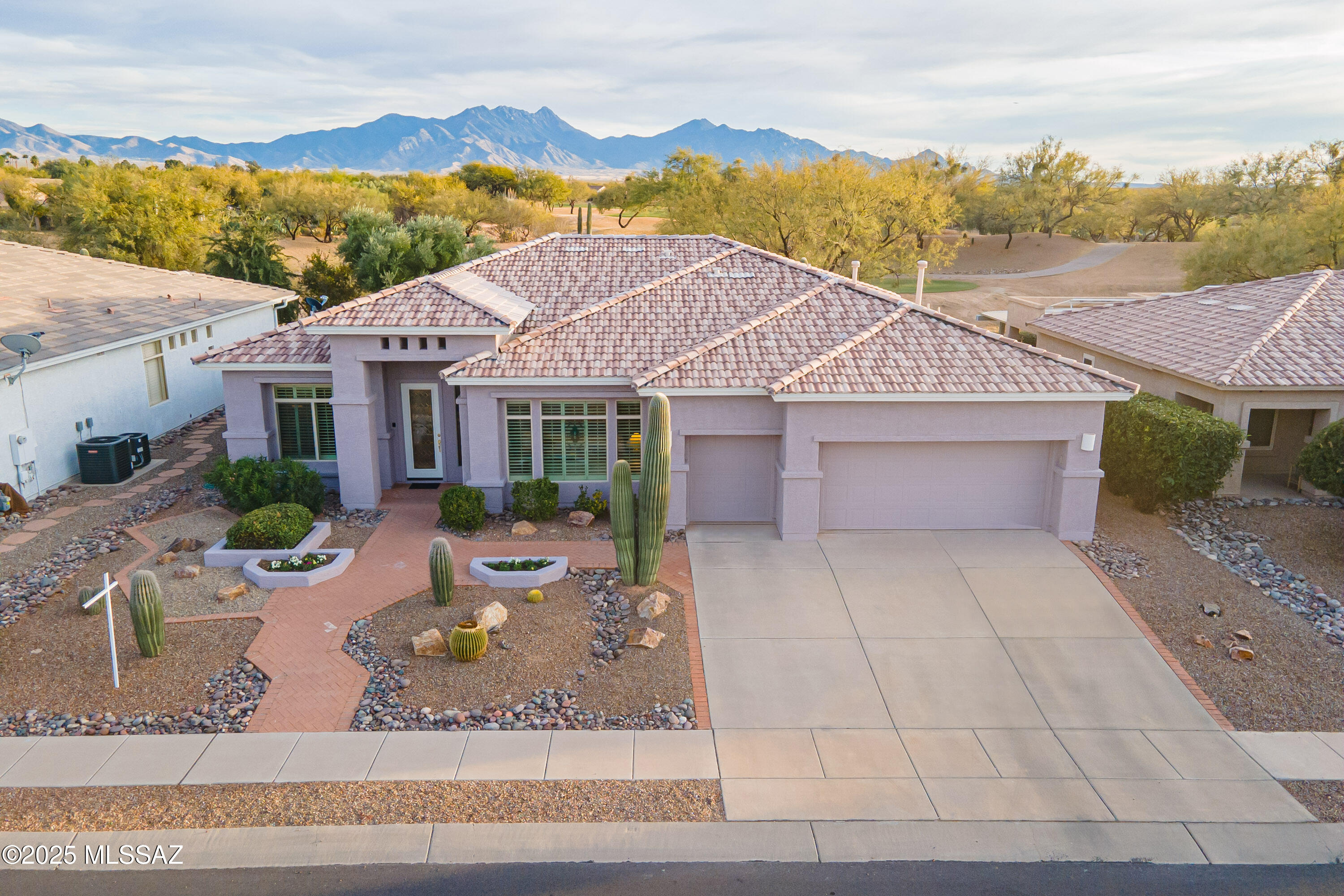 Welcome to this exquisite Rosalia Model Luxury Series home, offering a harmonious blend of comfort, elegance, and breathtaking views. Spanning 2,562 square feet, this meticulously maintained property is located in a premier community and provides unobstructed views of the golf course and surrounding mountains. With thoughtful upgrades and superior craftsmanship, this home is perfect for those seeking the pinnacle of luxury living.

	•	Garage Space: This home offers a spacious two-car garage and an additional golf cart garage, ensuring ample storage and convenience for your active lifestyle. Exterior Upgrades: The house exterior was freshly painted in 2024, ensuring a polished and modern appearance, while the roof was completely redone in 2021 for peace of mind.
	Sunscreens and Irrigation: Sunscreens on the south-facing windows provide energy efficiency, and a drip irrigation system ensures lush landscaping, complemented by large concrete planters.



Interior Highlights

	Ceilings and Shutters: Ten-foot ceilings throughout the home create an open and airy atmosphere, while plantation shutters add style and functionality in every room.

	Living Spaces: A versatile media room with built-ins and a custom-designed office in the den make this home ideal for both relaxation and productivity.

	Gourmet Kitchen:

		Hickory cabinets and granite countertops create a warm and sophisticated culinary space.

		Equipped with a smooth-top stove, pull-out three-speed vent with lighting, and new LG Double oven with convection and airy fry and microwave.
New GE Profile dishwasher.  This kitchen is designed for chefs of all levels.

		2 year old washer and dryer convey.



Comfort and Energy Efficiency

		Heating and Cooling: Two Daikin AC furnace units, just one-and-a-half years old, ensure year-round comfort with energy-efficient technology.

		Ceiling Fans: Ceiling fans in five rooms and two patio fans enhance comfort and airflow throughout the home.

		Water Purification: The Sigma water purification and softener system ensures clean, high-quality water for all your needs.



Bedrooms and Bathrooms

 	Primary Suite:

		This luxurious retreat features a spacious walk-in shower with a built-in seat, crafted with ceramic tile and glass blocks.

		The suite also boasts large windows which over look the golf course, perfect for enjoying serene views with your morning coffee.

	Guest Bedroom: Designed with comfort and privacy in mind, the guest suite is ideal for visitors or family members.

		Bathrooms: The home includes two-and-a-half baths, featuring high-quality finishes and fixtures.



Outdoor Living

		Patio: The south-facing covered and extended patio is perfect for entertaining or relaxing while soaking in the stunning golf course and mountain views.

		Equipped with a patio security door and two ceiling fans, this outdoor space offers comfort and security.



Additional Upgrades

		Central Vacuum System: Simplify cleaning with the convenience of a built-in central vacuum system.

		Custom Touches: Thoughtful design elements, such as a built-in media center and custom office design, elevate the functionality and appeal of the home.



This Rosalia Model is not just a home; it's a lifestyle. Whether you're entertaining guests, working from your custom office, or unwinding on the patio with panoramic views, every detail of this property has been carefully designed to provide a life of luxury and ease.



Don't miss this rare opportunity to own a home that combines unparalleled location, exceptional features, and timeless design. Schedule your private tour today and experience the best in luxury living!