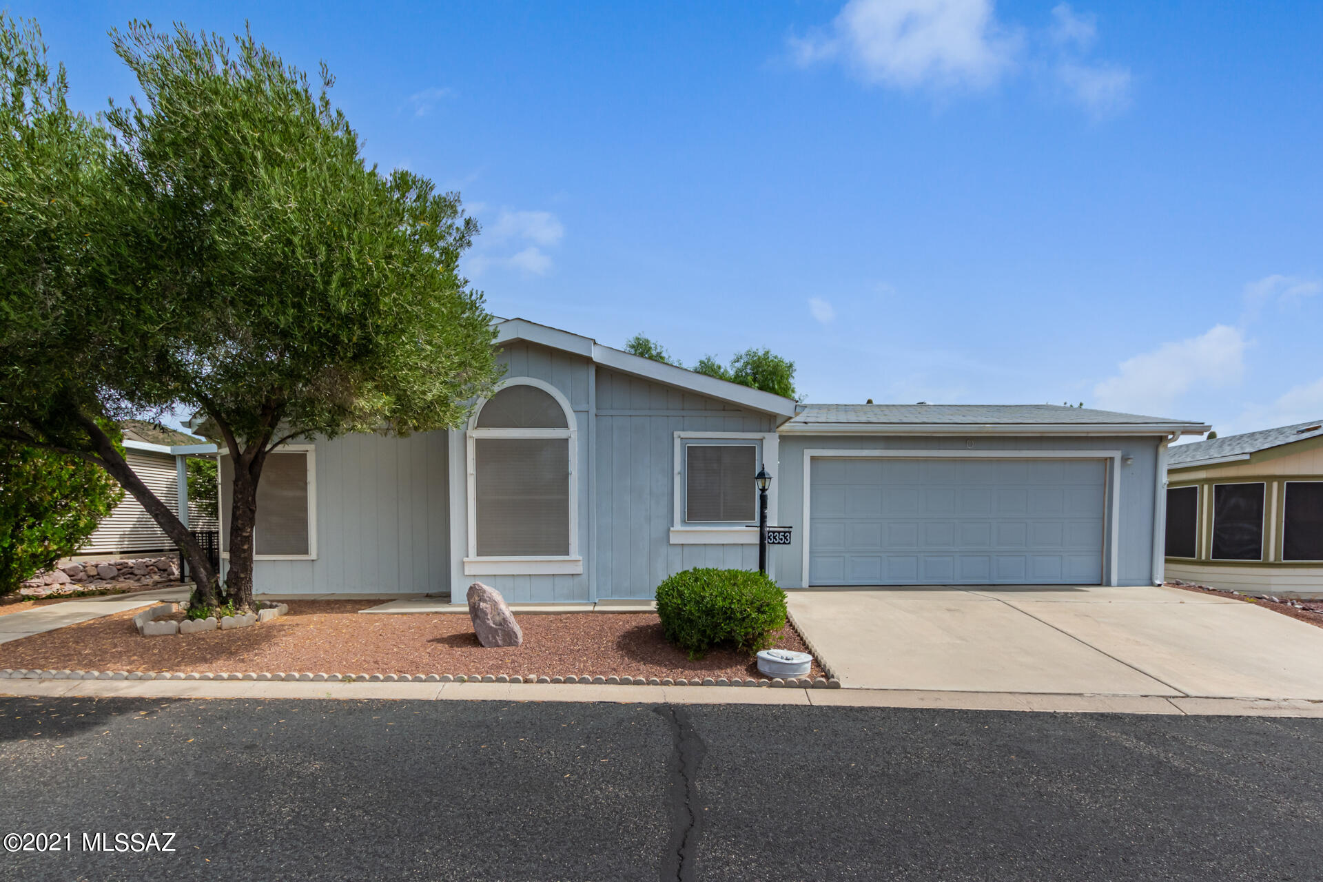 Check out this pristine 2 bed, 2 bath home in a wonderful community. Discover a welcoming palette, handsome tile floors, and vaulted ceilings, window blinds, & ceiling fans. An archway leads you to the formal dining room with bay window. Cook your favorite dishes in the delightful kitchen offering a plethora of white cabinets, stainless steel appliances,  center island, spacious counters, pantry, & breakfast nook. This home also features a den w/built-in cabinets/desk, patio access, & laminate wood floor. The primary bedroom boasts plush carpet, warm palette, walk-in closet, and private  bathroom w/dual sinks. Fantastic Arizona room for relaxing or entertaining guests.  The 2 car garage is complemented with large cabinets. Enjoy the backyard with a desert landscape. Call now for a showing!