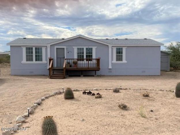 This home is GORGEOUS! And move-in ready! Don't miss this beautiful remodeled manufactured home on 1 acre! Fantastic floorplan has large master with huge walk-in closet and remodeled bathroom on one side and 3 bedrooms and full bath on the other. Gorgeous remodeled kitchen has tons of storage and a gas stove. All appliances will stay including W/D! Tape & textured walls with rounded corners. New HVAC in 2019 & new roof installed 10/2020. Front and back decks for amazing mountain, sunset, sunrise, and starry night views! 10x12 shed and 10x18 shed offer lots of extra storage and workshop space. Termite warranty with Terminex in place until January. This is horse property with very useable flat land! Located in the award winning Vail School District.