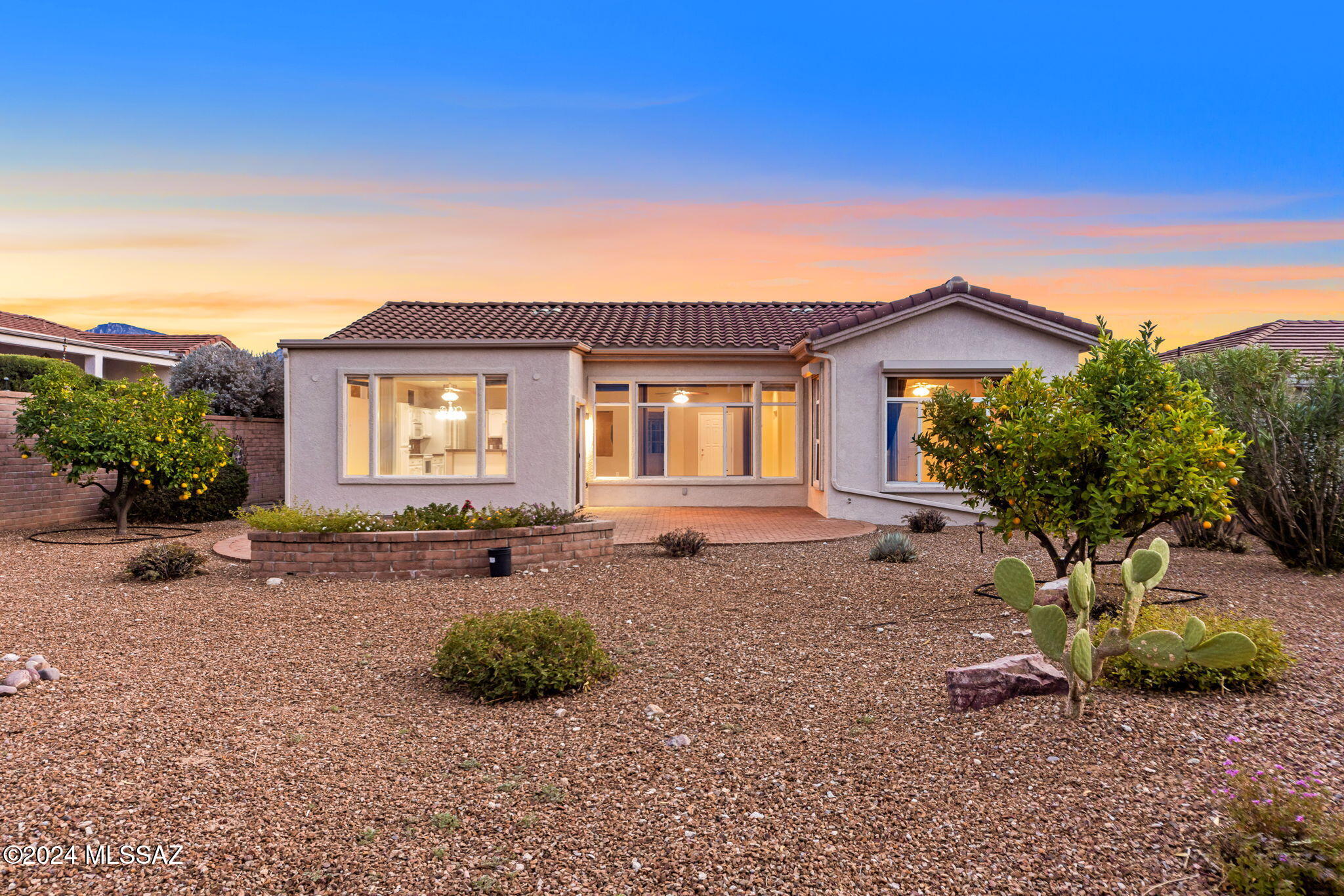 Sun City Oro Valley - This Bright & Beautiful Expanded Crescent Model 1,700 sq. ft. home has 2 Bedrooms, 2 Full Baths, Den / Office & an extra-large Dining Area. This desirable model features an Open Great Room Concept with a pretty White Kitchen w/ Breakfast Bar, Large Family Room and Dining Areas all open. There is also a Den / Office and Large Laundry Room w/ Storage. The Owner's suite has a wonderful Walk-in Shower and Walk-in Closet. The Back Yard is Large & Private w/ a pretty Block Fence & Extended Paver Patio . This gorgeous home is move in ready! Recent Updates include: House Painted 2024, New Roof 2023, New HVAC 2020. Sun City Oro Valley is a 45+ Active Adult Community w/ an 18 Hole Golf Course, Fitness Ctr., 2 Pools, Pickleball, Tennis, Restaurant / Bar, Clubs to join & more!