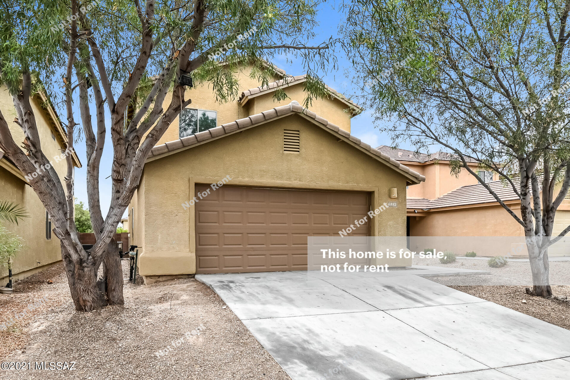 This Tucson two-story home offers a two-car garage. This home has been virtually staged to illustrate its potential.