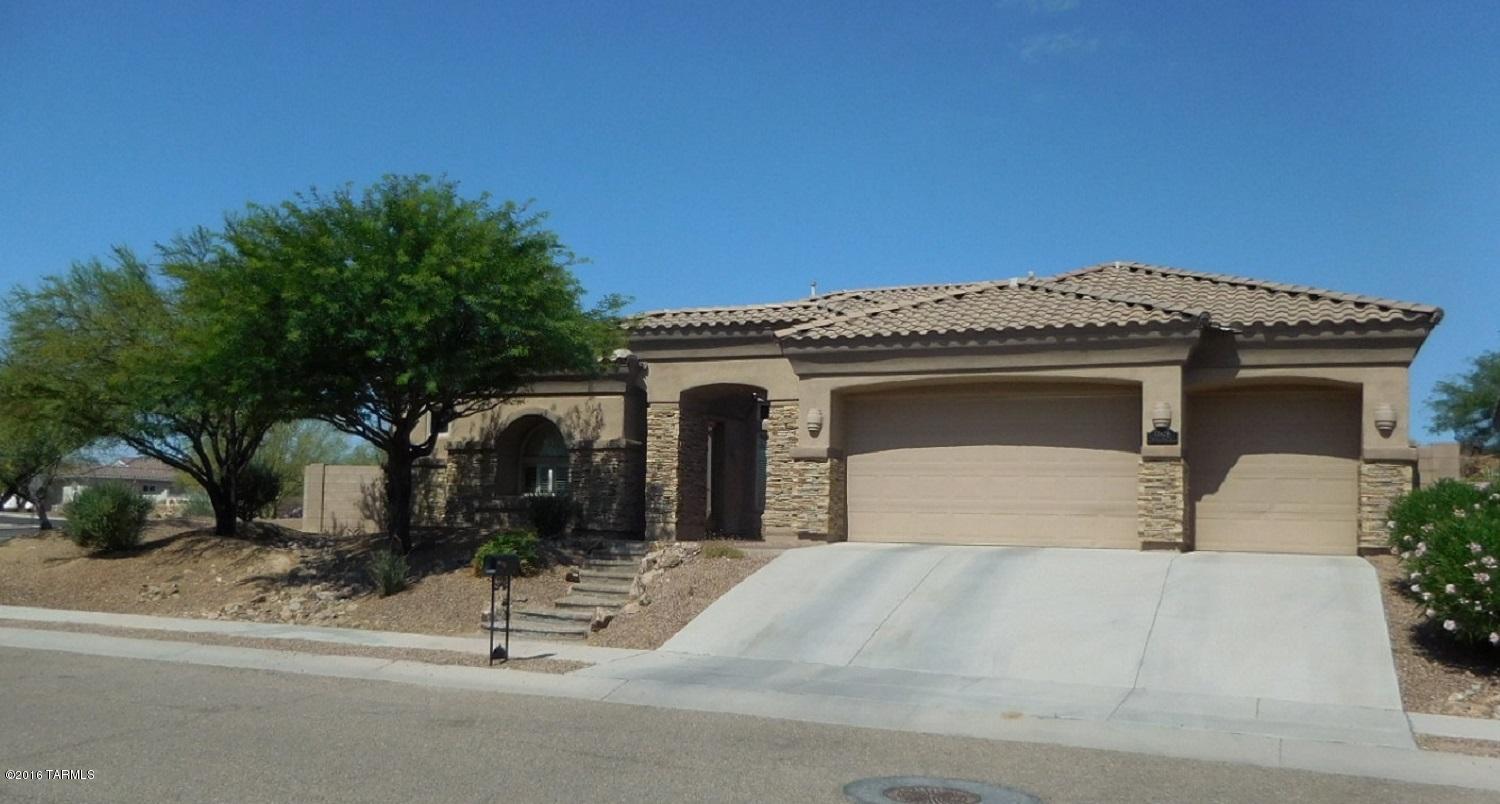 Must see! Beautiful 3 bedroom 2 ½ bath home in Sunset Ridge. Semi-custom stone accented 2965 sf home with pool and 3 car garage. Front courtyard and gorgeous entry with coffered ceiling. Great room opens to large kitchen with cherry cabinets, island, granite counters and breakfast area. The expansive Master suite has door to patio area, large bathroom with 2 separate vanities, jetted tub, glass block shower and huge closet. Perfect den / office space with separate entrance. Other features of this beautiful well maintained home include formal dining room, lighted niches, ceiling fans, travertine and dark tone Pergo floors, large laundry room with washer and dryer, split bedroom floor plan, 2 sliding glass doors to the covered patio and private back yard and fenced pool area.