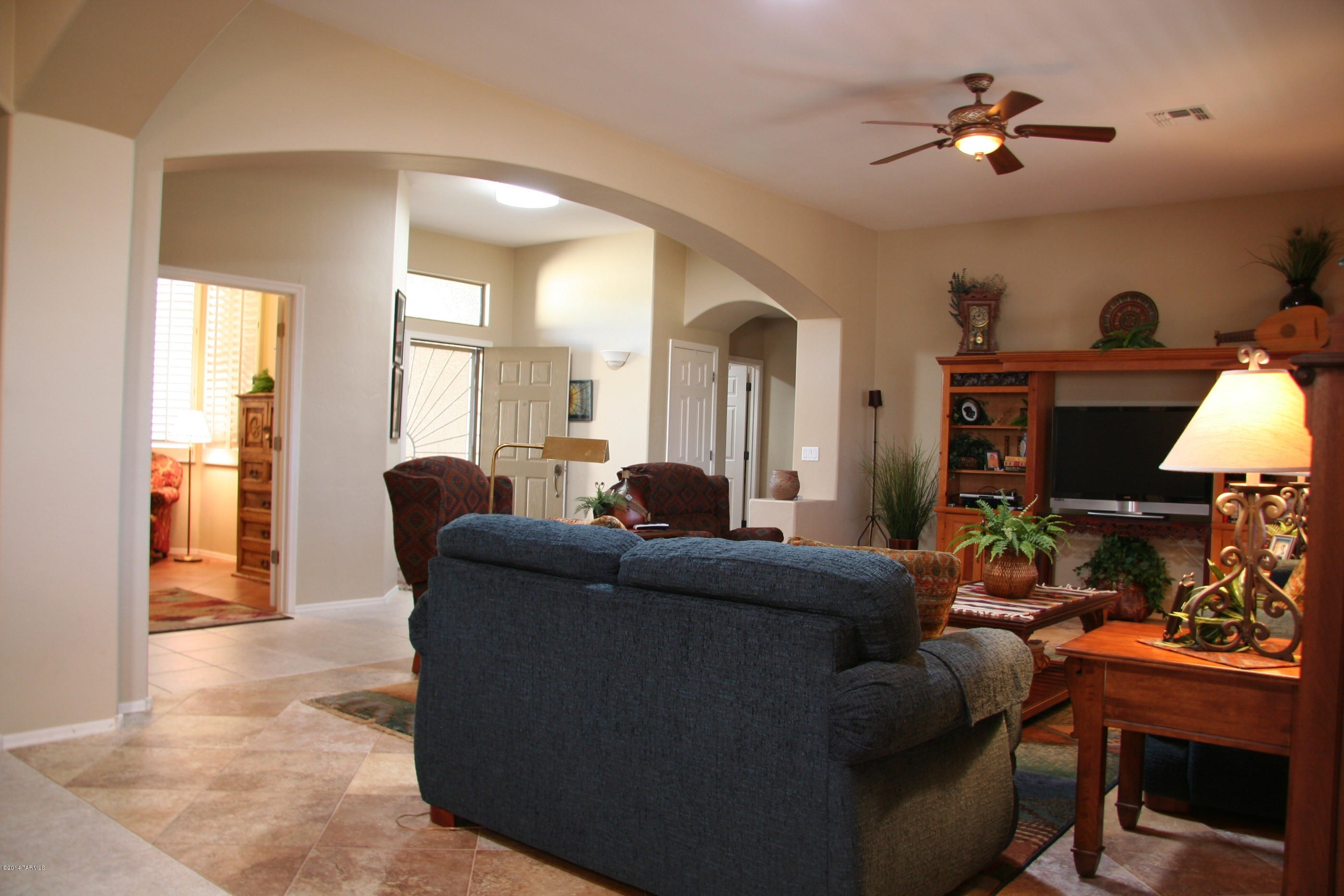 An Award winning Home, by Richmond American, boasting w/upgrades. The inviting entry opens to a Great Room Floor Plan with Beautiful Archways, 10' Ceilings, Plantation Shutters, Ceramic Flooring throughout w/Carpet in Bdrms. 3 large BDRM-3FULL BA, (2 MSTR Suites) perfect for multi-generation or Guests. The Den has Beautiful Glass French Doors, could be a 4th Bdrm. Kitchen has Pull-out Shelves, Granite Counter, Granite & Tile Backsplash, Walk-in Pantry and ALL Appliances included. Solar Tubes & Solar Screens add to the energy savings each year. The Patio has a power louvered cover which adds to outdoor enjoyment. Backs to Natural Wash and the 12 Tee Box of Rancho Del Lago Golf Course (out of G-Ball Range) but still offers privacy. Low Care landscaping Front & Rear.