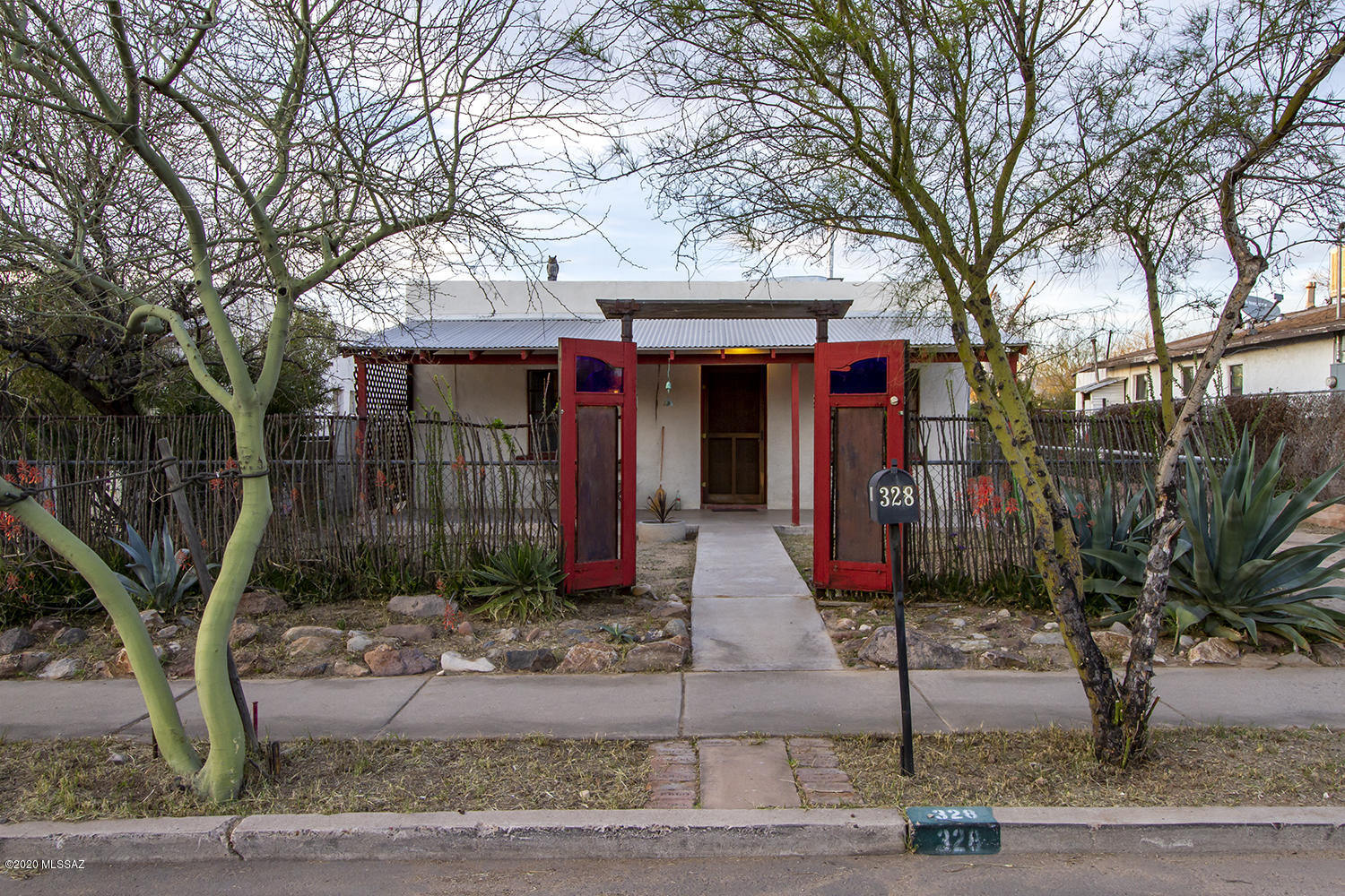 Affordable classic sonoran. Thick mud adobe walls, polished concrete floors. The open floor plan connects kitchen dining and living room. large backyard perfect for the urban farmer. Easy access to downtown Tucson, shopping and dinning.