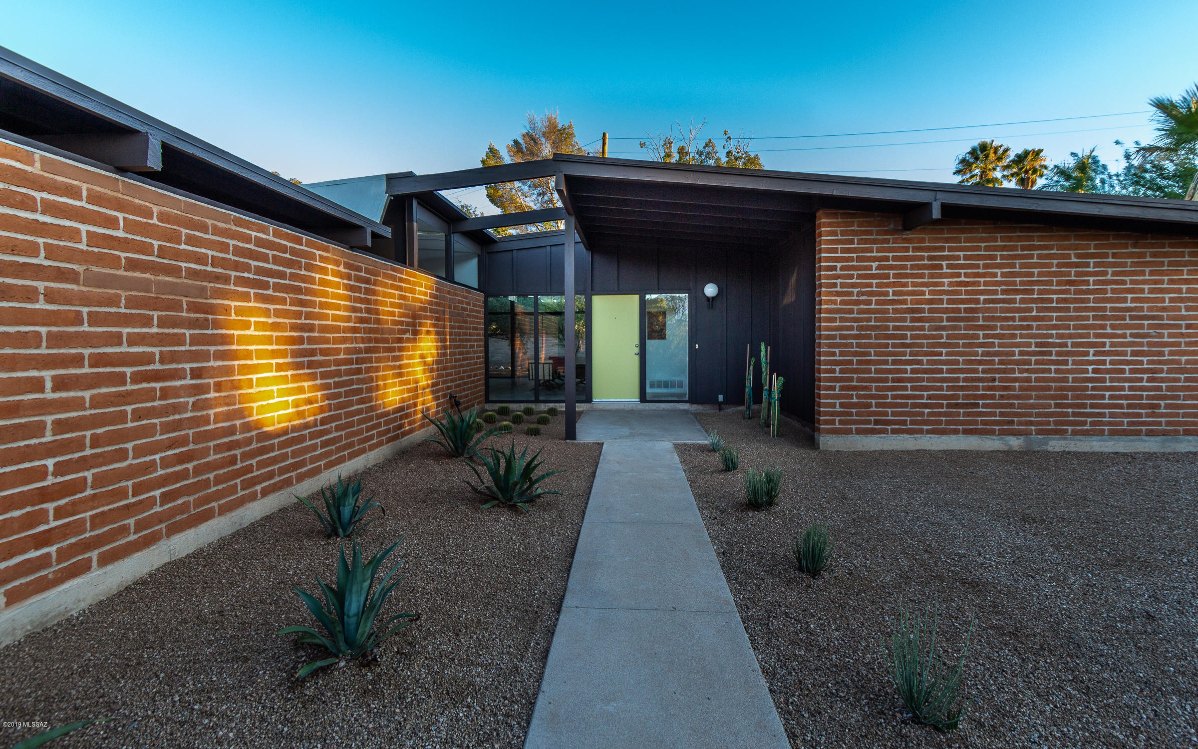 Classic Midcentury Modern Home. For those who appreciate great architecture, you'll enjoy this beautiful mid century modern home in Windsor Park. You'll love the burnt adobe, large walls of glass, wood beamed ceilings, travertine tile throughout, and the large yard. 
The walls of glass look onto a spacious tree filled backyard. And each of the 3 bedrooms has a sliding glass door for easy indoor/outdoor living. This floorplan is fantastic for entertaining small gatherings or large crowds. 
See first-hand, why builder J. Herbert Oxman and Ambrose-Swanson Architects won the ''Best Home for the Money'' award from American Home Magazine in 1963.