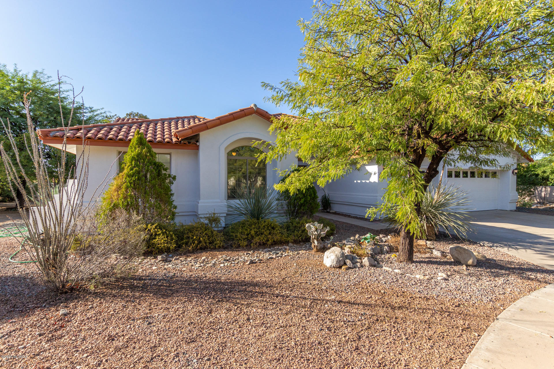 Stunning 4 bed/2.5 bath north Tucson home available in on nearly 1/2 acre cul de sac lot in prestigious Sabino Creek. Gorgeous inside and out this gem features an elegant formal living/dining area as well as a separate open concept family room, each enhanced with a charming fireplace. Soaring ceilings, neutral paint tones and gleaming tile flooring throughout. Chefs kitchen boasts gas cooking, sleek stone countertops, ss appliances, stylish backsplash, an island/breakfast bar and a sunny bay window dining nook. Exquisite master en-suite with dual vanities and a separate soaking tub and shower. 3 car garage. Sliding glass doors lead to the secluded backyard entertaining space complete with mature desert landscaping, a covered patio and a sparkling pool and spa. See it and make it yours.