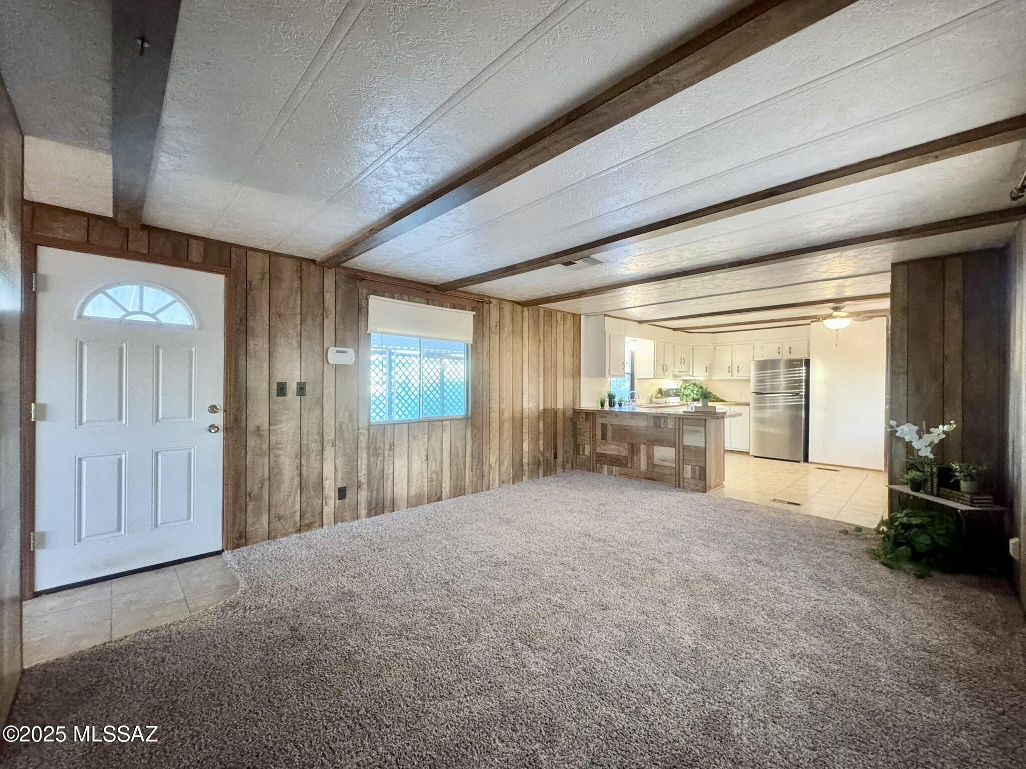his Mescal Lakes home features a covered deck and carport, 3 storage sheds (one with power), and a fully enclosed yard. This 2 bedroom, 2 bathroom mobile home offers a spacious living area that opens up into the kitchen with the bedrooms on opposite ends for maximum privacy. The home is clean and comfortable, with new carpet, new PEX plumbing under the house, new blinds and screens, a new toilet in the hall bathroom, and all appliances are included. This is affordable at its finest. Come. See. Stay.