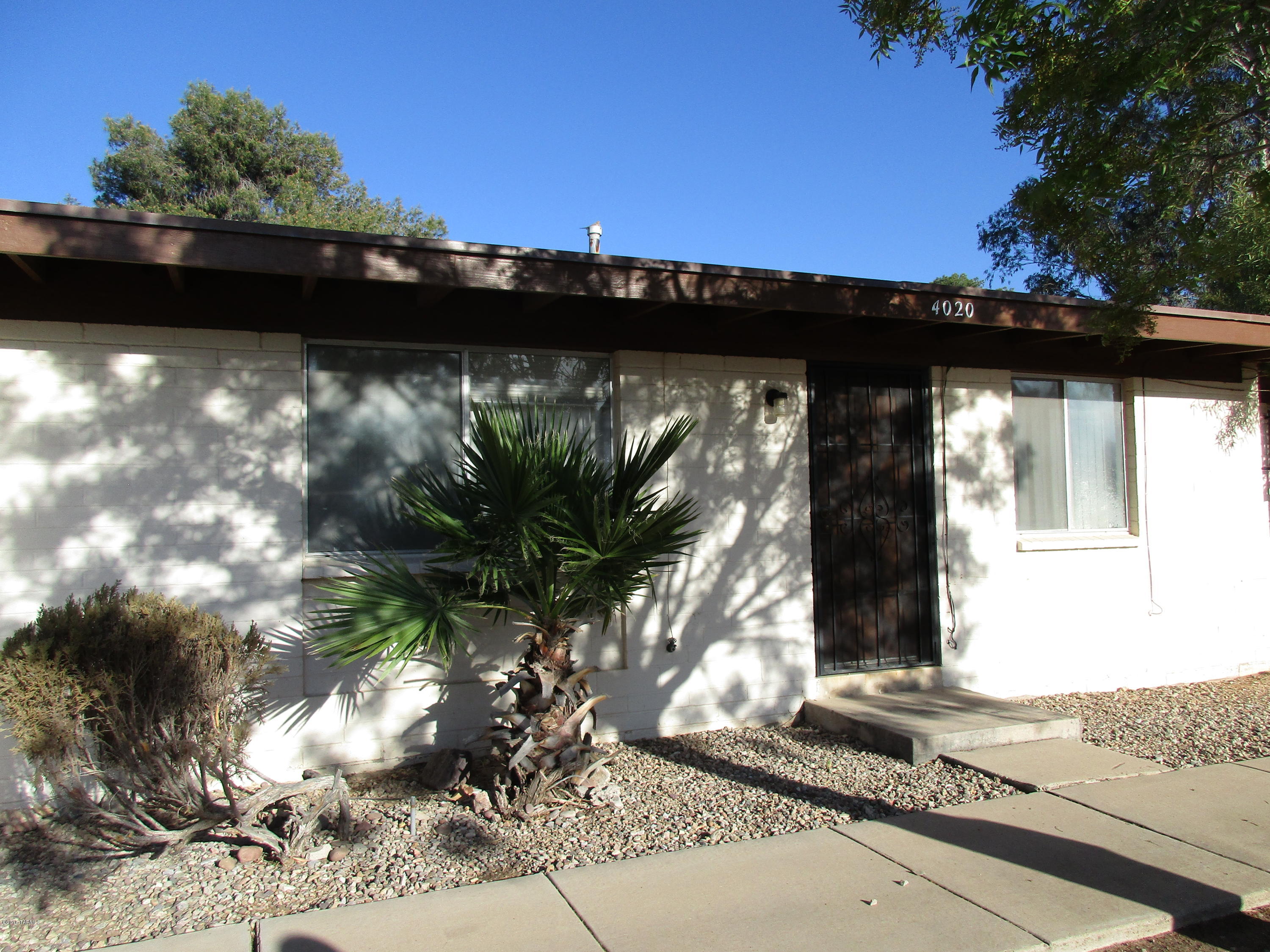 Great find! Grassy courtyard in front. 2 bedrooms, 1 bathroom. In back is a fenced yard and there is a covered patio and shed!