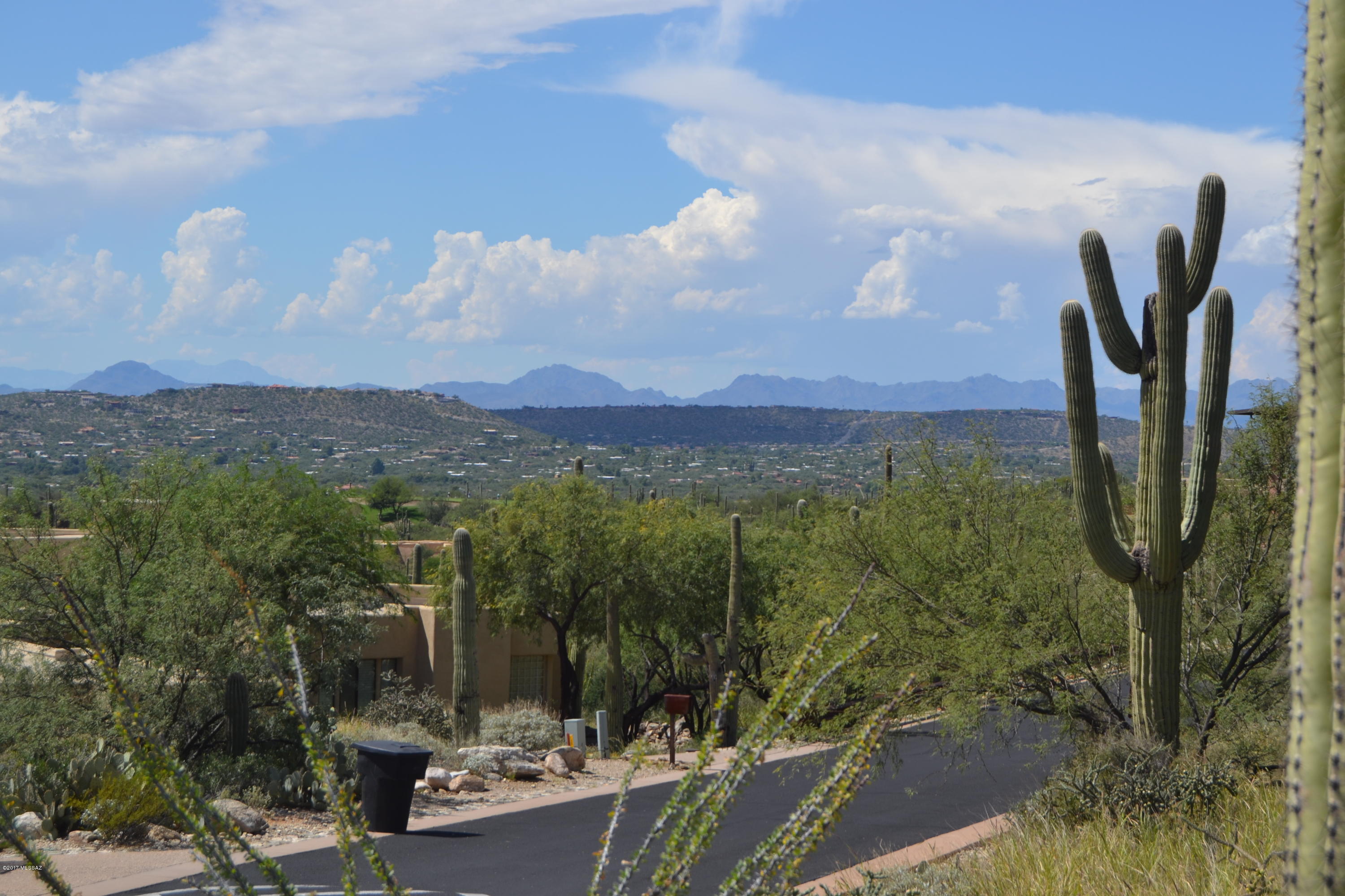 SECURITY, LOCATION, VIEWS, AND PRIVACY. Security: located through the manned guard gate of Sabino Springs, then through an additional electronic gate that provides access only to residents and guests of Sabino Estates. Location: This lot is located on the boundary of the National Forest, close to the end of a cul-de-sac. Views: elevated above the surrounding homes and topography there are uninterrupted views of the city lights, the surrounding mountain ranges, and thousands of sahuaros all around you. Privacy: the lot is over four acres, with most of the surrounding lots being similar size, guaranteeing a big buffer of desert between all homes in the area. All photos attached were taken from the lot.