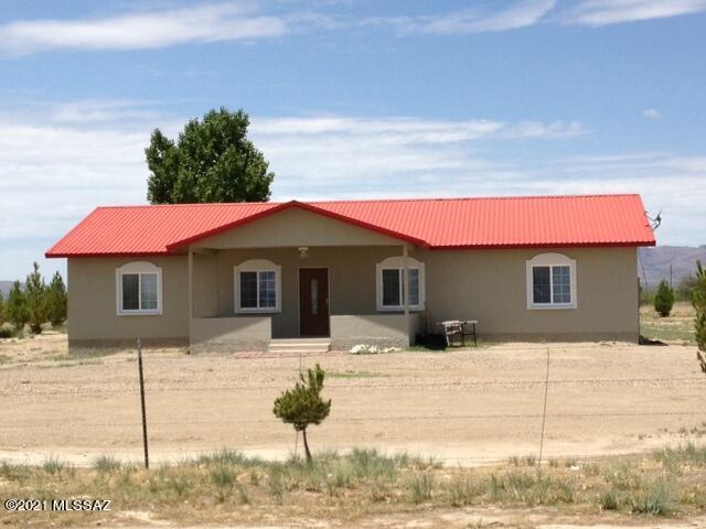 Out in the country but close to town.    Home has 9 plus acres, metal roof, beautiful kitchen cabinets,  4 bedroom, split bedroom floor plan. Covered porch in front for outdoor living,  wonderful mountain  views.    Easy access to I-10.  Zoning is RU2,  one house per two acres.  Private well, 55-570592.   No HOA.   Please do not disturb tenant, we need two-day notice to show. Tenant needs 60 days to vacate.