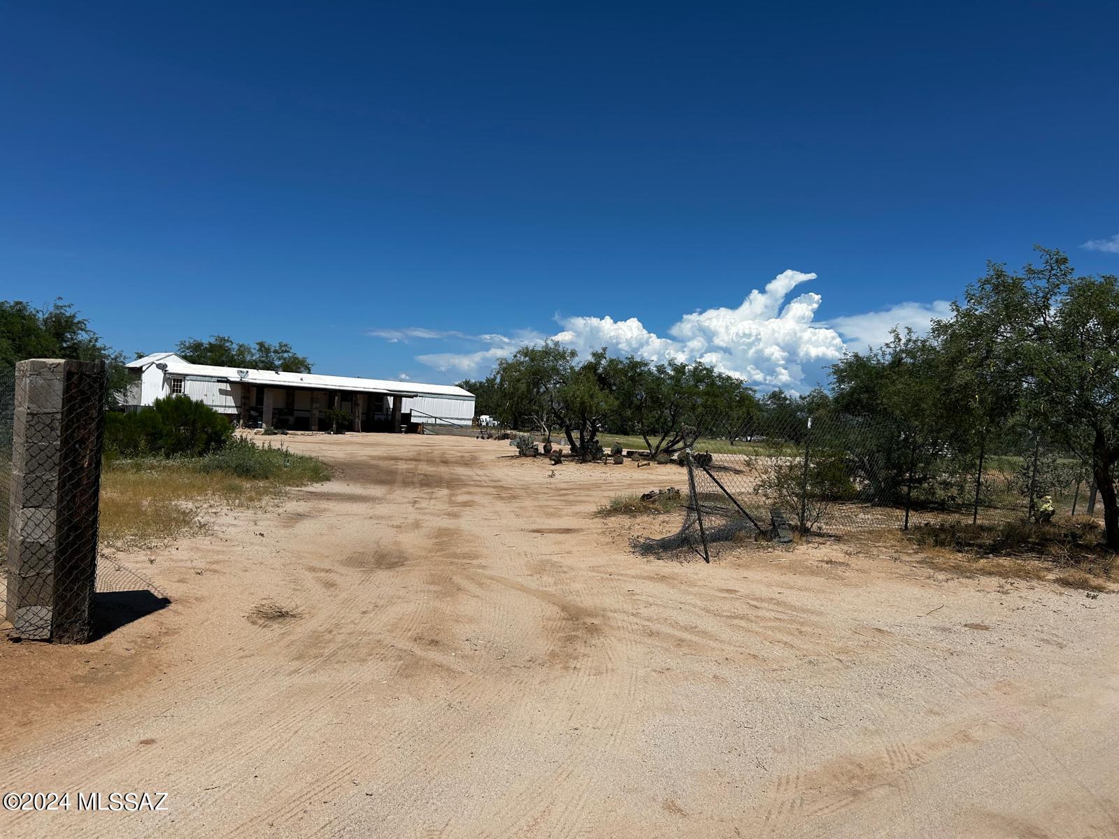 This fully fenced vacant land offers the perfect canvas for your dream property! You'll love the stunning mountain views that create a serene and picturesque backdrop. Nestled on the lot is a mobile home that conveys with the sale, providing immediate living space or an opportunity for renovation. Whether you envision building your custom home or using the mobile home as a base, this property offers endless potential. The expansive open land allows ample space for gardening, livestock, or outdoor recreation, all while enjoying the natural beauty and tranquility of the surrounding mountains. Seize this opportunity!