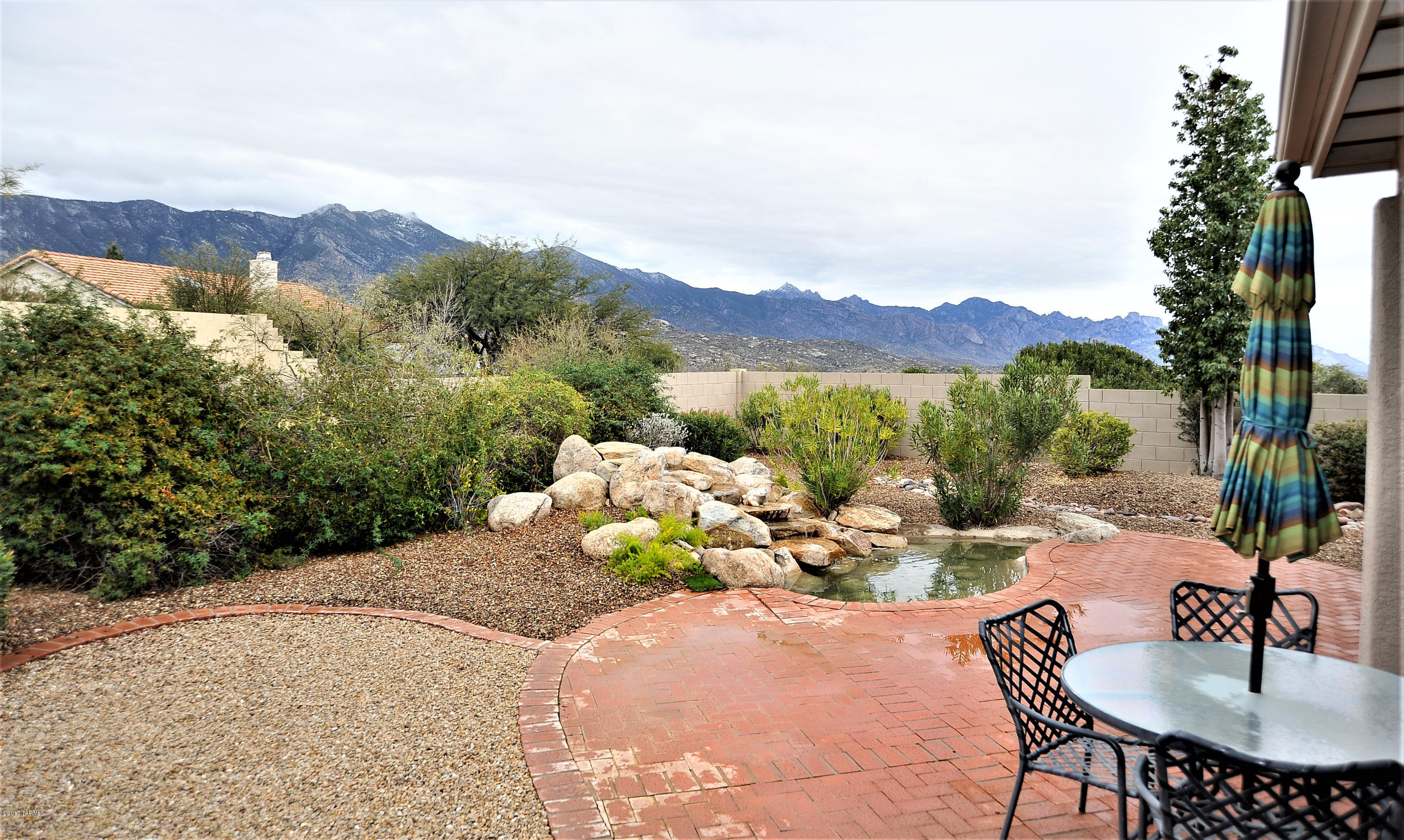 First time on the market.  2x6 construction Galleria has large main floor master suite with bay window.  The master bath has his and hers walk-in closets, garden tub, separate shower and dual sinks.  The large office/den is just off the entry, opposite the formal living and dining room with 1 of 2 gas FP's.  Follow the wide staircase upstairs to 2 very large bedrooms with a full bathroom. The kitchen has plenty of storage with white cabinets, pull-outs, walk-in pantry & breakfast nook. A custom library wall adorns the great room w/2nd gas FP.  The covered patio offers fantastic east facing mountain views and the soothing sounds of water from the custom waterfall feature nestled in the landscaping.  The home has been gently used since 1995.  Priced to add your own touch, sold as-is.