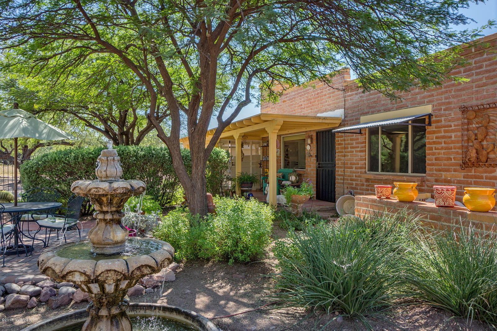 Charming Southwestern 3 bedroom with den home located in quiet established neighborhood just north of the Tubac Golf Resort.Large lot with majestic mature mesquite trees surrounding the house.Inviting shaded front entry with tranquil garden, fountain & brick patio. Attractive wrought iron fencing around entire house.Fully remodeled kitchen with new cabinets, Corian countertops and glass tile backsplash. Fresh paint inside and out and new windows and coverings. Private entrance to 3rd bedroom with private bath and heating/cooling system.This room has potential for an art studio, craft room or office.You're going to fall in love with this delightful desert dwelling.Just perfect for year round or for a quiet winter get away. Clean & ready to move in - don't miss out on this gre
