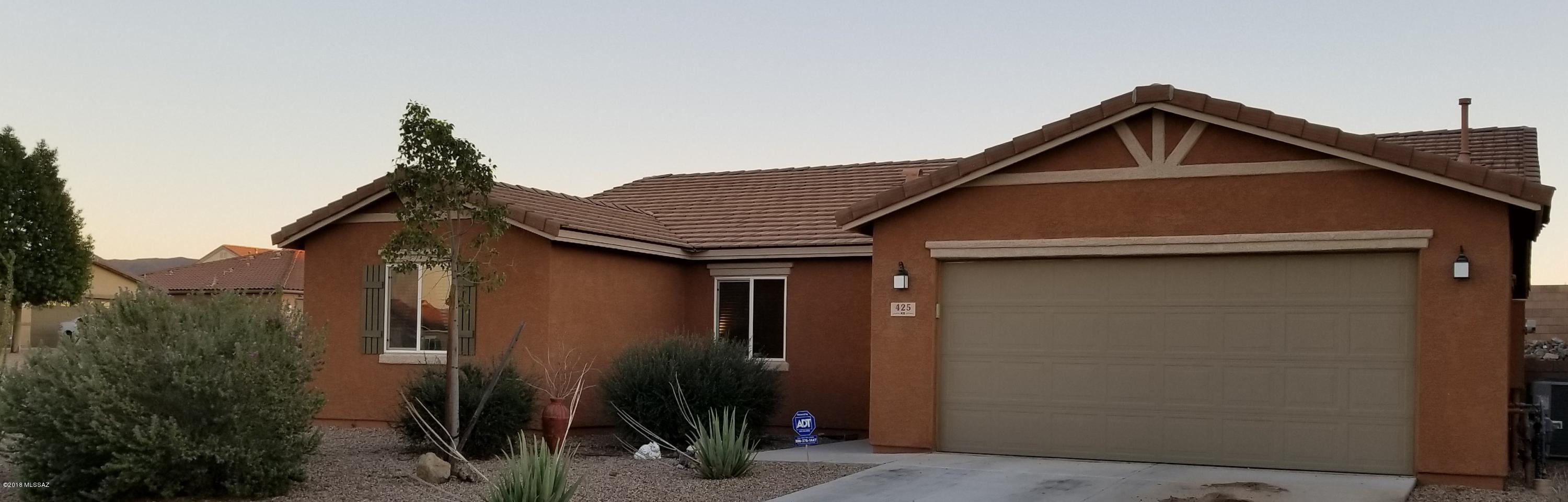 Lovely contemporary home on a large corner lot, offers a spacious open eat-in kitchen, & great room concept for entertaining.  Kitchen with ample cabinets, large island, granite counter tops, gas stove, and refrigerator included. 4 bed/2 bath, Plus a Den, gives lots of room for family & friends.  Sliding patio door takes you to the large covered patio & yard raised flower beds, low maintenance yard, front & back.  Laundry room with shelving for storage.  Looking for space come take a look, you will enjoy what you see.