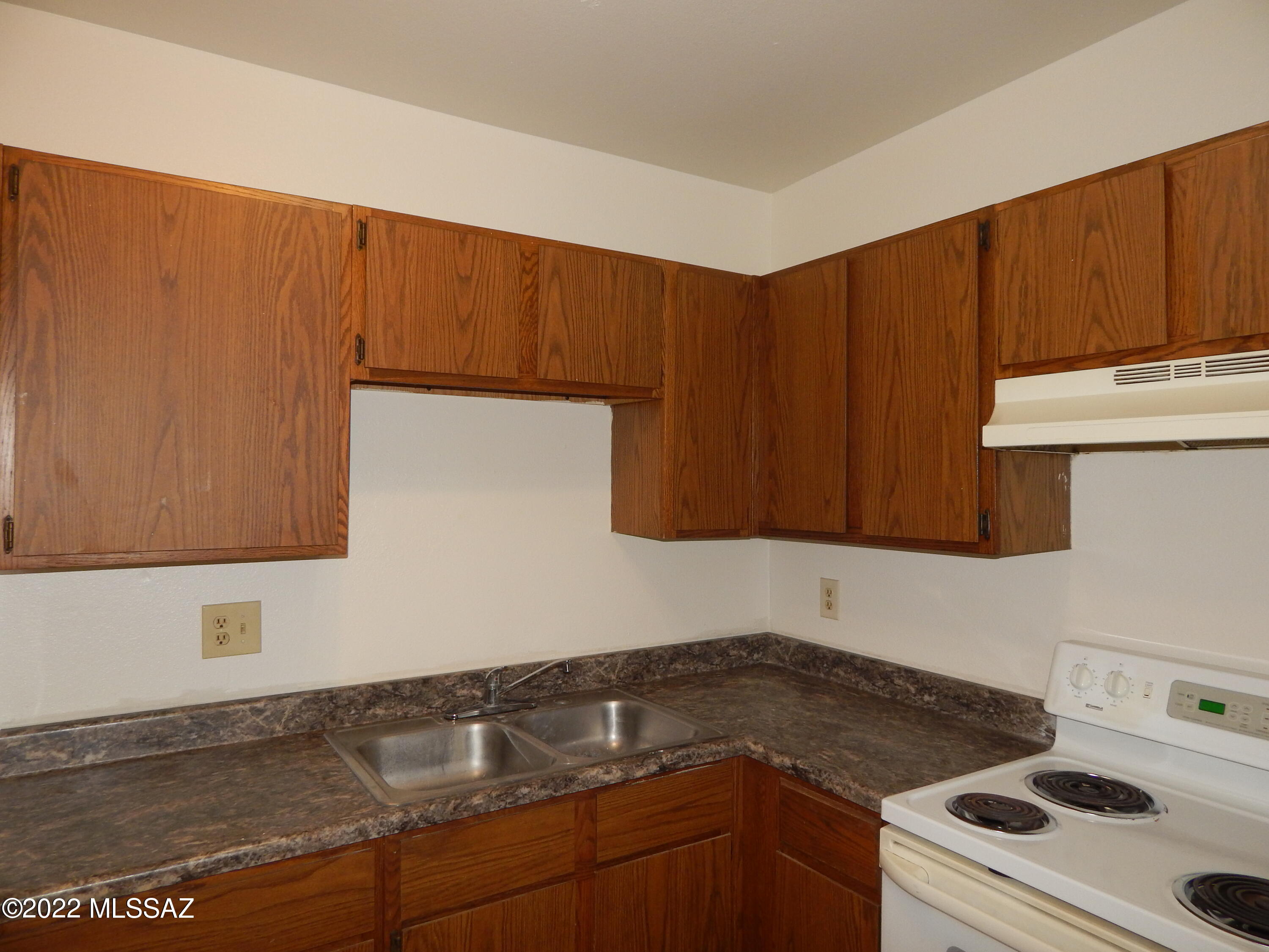 CENTRAL AC! 2 Bedrooms - 1 Bath Unit with FRESH Paint throughout.  Available NOW! Close to all major amenities including bus stops.  Living Room has sliding glass door that leads to patio area with extended brick area.  Kitchen has new stove and lots of cabinets plus a Pantry closet.  Washer and Dryer area are across from kitchen. 2 good sized bedrooms - 1 has door that leads to back patio area. Both have ceiling fans. Assigned parking spaces in back lot. Guest parking is on Laguna Street. Water-Sewer-Trash is included in rental price. Tenant pays gas and electric. Call today for a showing of the property - THIS ONE WON'T LAST LIONG  Applications are online at www.PimaRealEstateServices.com