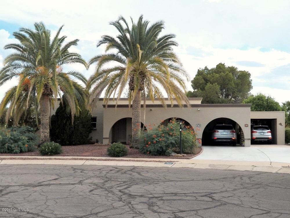 This Southwestern territorial home combines the charm of an established neighborhood with recent interior and mechanical improvements to create a comfortable lifestyle. Set back on a cul-de-sac far away from traffic, this 2BR, 2BA home exudes privacy. The interior displays laminate and ceramic tile flooring  no carpet. Newer vinyl dual-pane windows are found throughout including the 10x26 heated and cooled Arizona room offering beautiful views and easy access to the serene backyard. The 12x12 den is open to the living room and sometimes used for formal dining although the kitchen has a large eat-in area. As you tour the home notice the plantation shutters, newer appliances and the overall clean, well-maintained appearance.