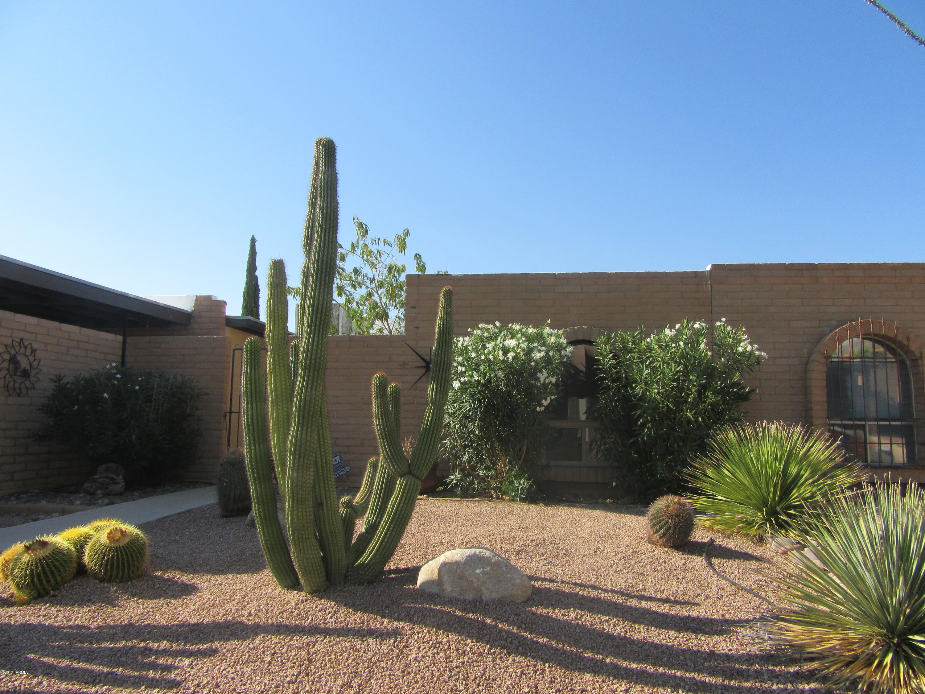 VIEWS! Wonderful town home with ceramic tile floors through out, separate family room with cozy beehive fireplace and area for informal eating & slider to outside wrap around patio!  There is a spacious enclosed Arizona room looking out to back patio. Nice backyard with easement at the back.  Enjoy the community pools and spa. Close to shopping and restaurants.