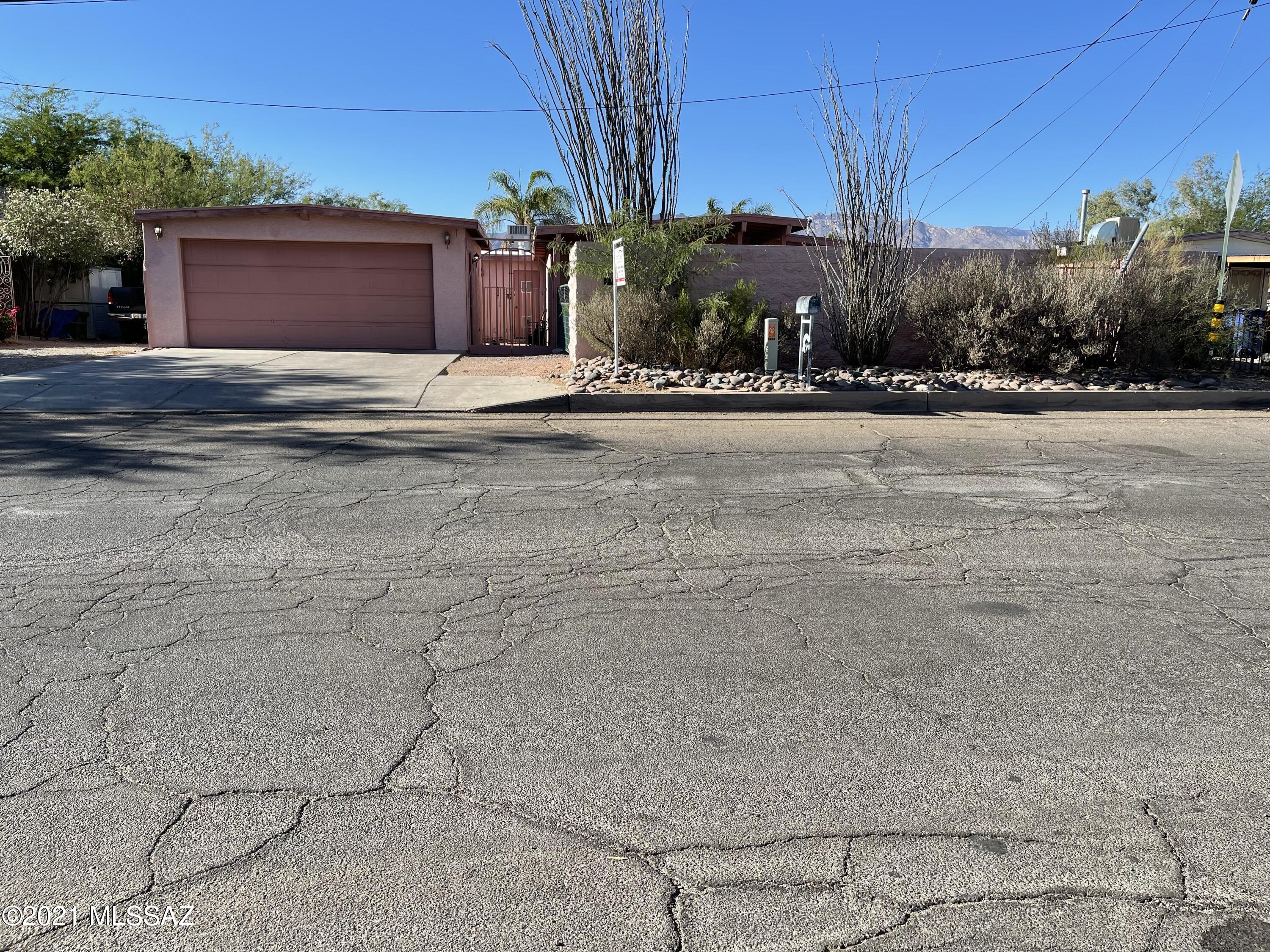As is property located in a desired area with potential to upgrade and make it your paradise. It is a 3 Bedroom 2 bath,1703 sq ft. Home has a living room and an Arizona room with a fireplace. Kitchen has stainless steel appliances and a skylight. Dining room off Kitchen. Tile throughout the home. Detached 2 car garage. Opportunity to restore inground pool and landscape your backyard  to be your relaxing haven, A great opportunity to upgrade to your personal taste. Shopping, & restaurants near.