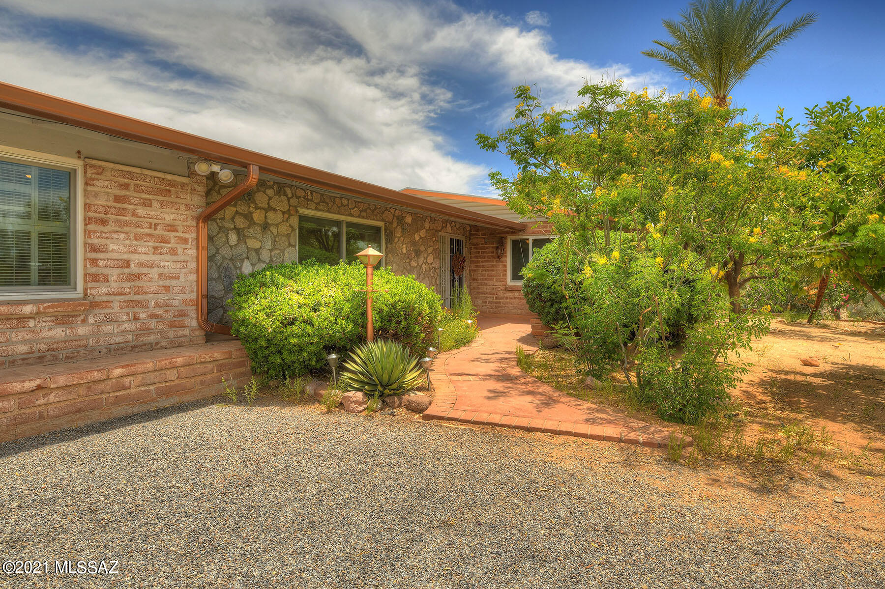 Sought after Casa Adobes neighborhood with views of the Catalinas! Large lot, over an acre, tucked away in a Cul-De Sac. Flowing floor-plan offers a spacious living room w/exposed rock fireplace as well as a separate family room w/built-ins & cedar closet. Gourmet kitchen w/ soft close cabinetry, double oven, 5 burner gas range, & granite counters. Ceramic tile & laminate flooring throughout. Office/den w/built-ins is  ideal office/gym/playroom. 3 generously sized bedrooms. Private & serene yard w/ extended covered patio & refreshing pool! Freshly painted interior. Brand new roof to be installed 6/21. Gorgeous mature landscaping. Large 2 car garage w/tons of storage. Close to Casas Adobes shopping center, Whole Foods, recreation, schools, as well as casual & fine dining. Come see today!