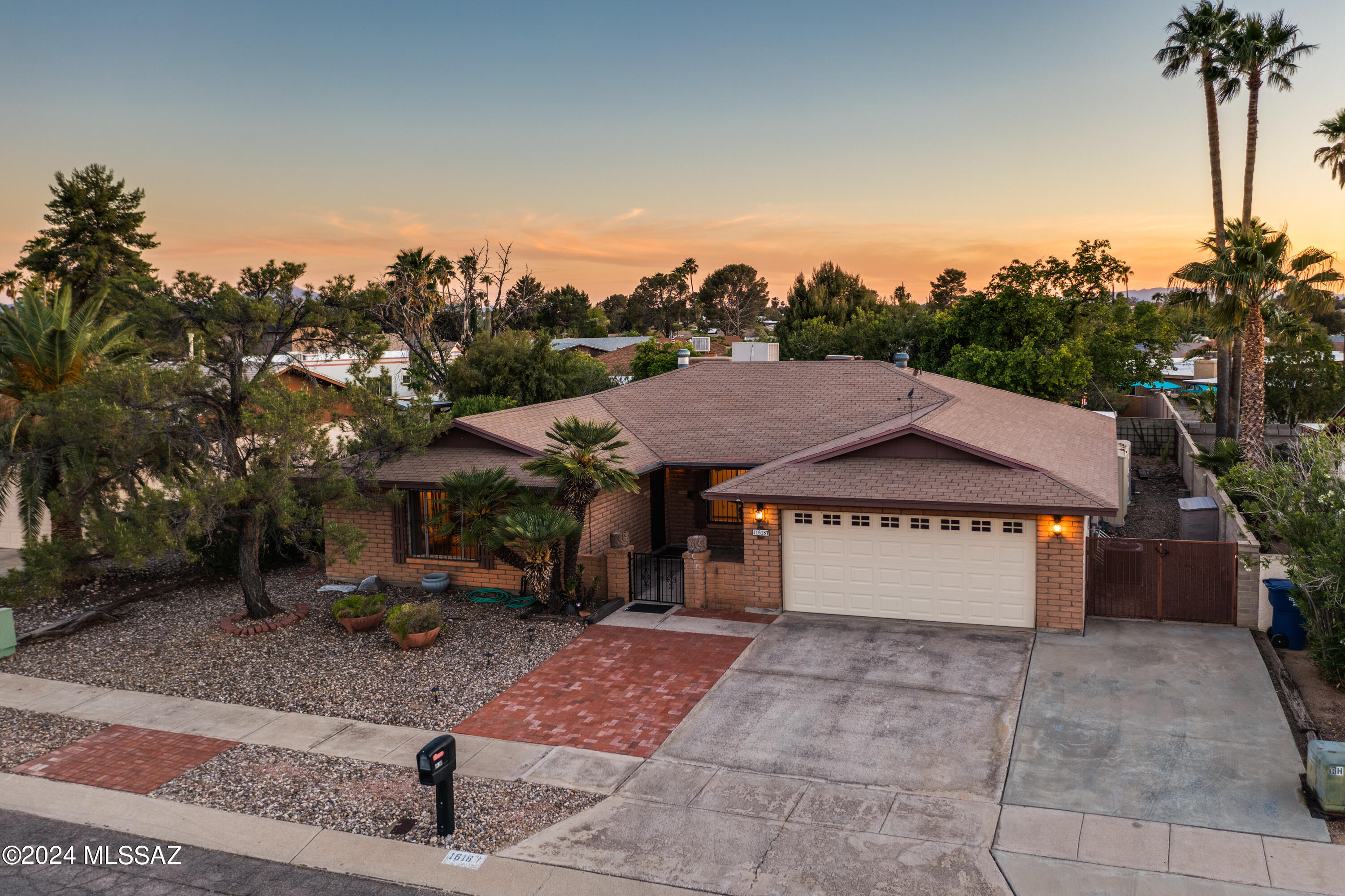 This charming 4 bed/2 bath home is conveniently located in the desirable Rolling Hills Golf Course neighborhood on the east side of Tucson. 
It has an open, updated kitchen with custom wood cabinets, granite countertops & a bar that opens to the cozy family room and gas fireplace.
The home has been well maintained & it features a lovely backyard with a large, covered patio, a built-in gas BBQ, grass & a water feature.
The two car garage has a built-in work bench. storage, refrigerator & attic access for more storage

No neighbors across the street, No HOA! The public golf course offers membership as an option. Rolling Hills Park offers tennis courts, basketball courts, playground & pickleball courts. Something for everyone. Call now for a showing, it won't last long!