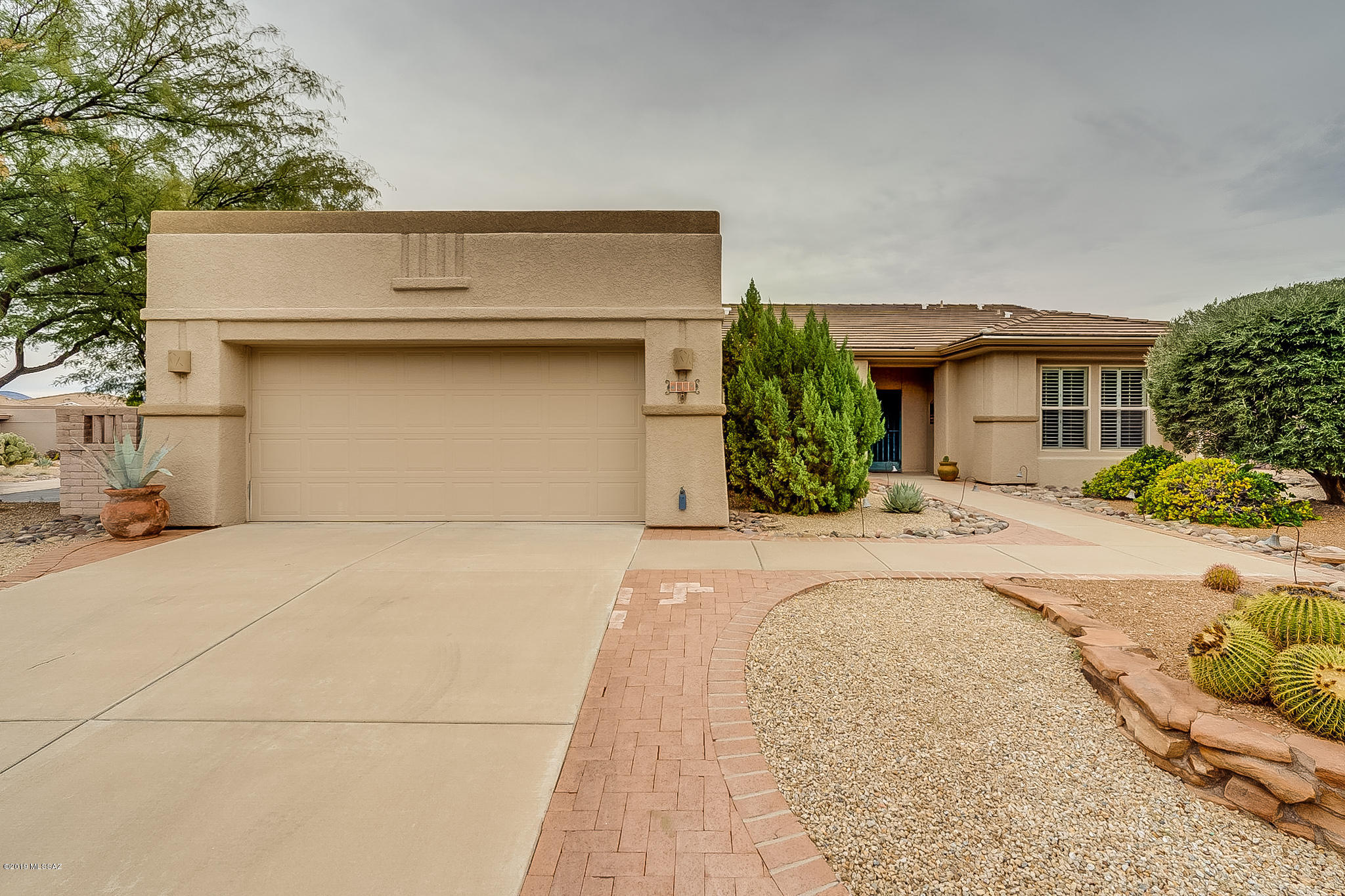 Welcome home! 2 bedrooms AND a den with 2 full bathrooms. NEW ROOF 2018! NEW FLOORING! FRESHLY PAINTED INSIDE! The home has an open concept living/dining/kitchen area. Formal dining area as well as an eat-in breakfast nook. The kitchen has gorgeous corian counters with custom ash cabinets and plentiful storage with a large pantry. The spacious master suite has dual sinks in the vanity and separate shower and jacuzzi tub. The dual paned windows are adorned with wooden shutters. A full laundry room with storage and washer/dryer included. Large 2 car garage has wash basin and storage. Outside is a large covered patio and fully landscaped backyard with built-in grill and pond with waterfall. Don't let this one pass you by!