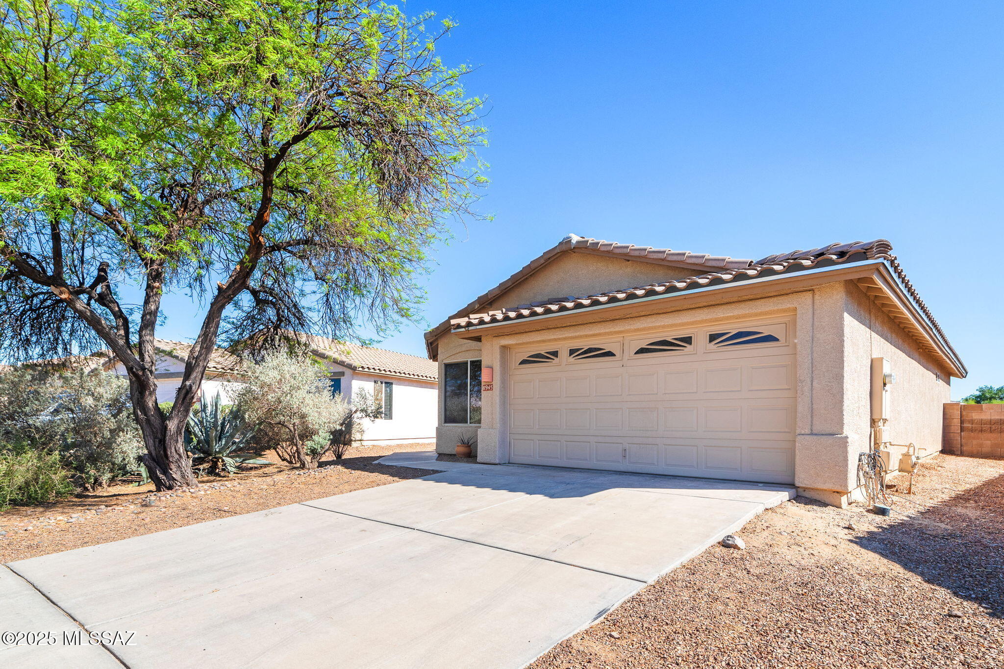 Tucked away in a quiet cul-de-sac on an elevated lot, this 3BD/2BA home boasts stunning mountain views and an open, bright layout. Recent updates include fresh interior paint, new carpet, updated flooring, and modern fixtures. The kitchen features granite slab countertops, and all appliances, including washer and dryer, are included. The spacious primary suite offers a double vanity and walk-in closet. Enjoy the large, walled backyard with a covered patio, perfect for entertaining. Located in the sought-after Bluffs neighborhood, close to I-10, shopping, dining, and a hospital. Low HOA fees and community amenities, including a park, playground, and basketball court. Listing agent is the owner.