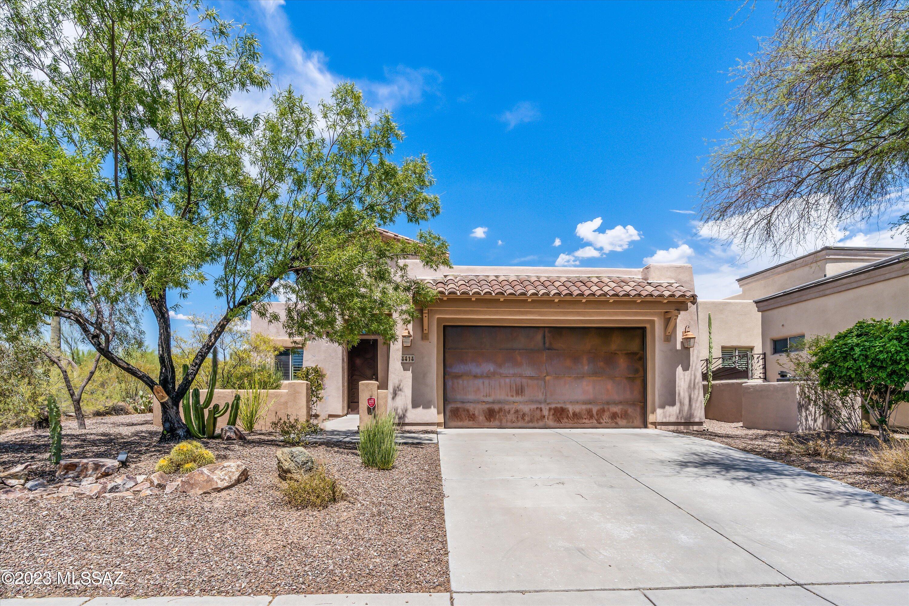 Beautiful home in Sky Ranch backing to natural desert offers an added sense of privacy & spaciousness w/yard bordered on entire side & front by common area/wash. 10ft ceilings, no carpet, tile & engineered wood floors throughout, plantation shutters & clerestory windows compliment this 3/2 split floor plan. Spacious kitchen w/upgraded cabinets & granite countertops. Large primary suite & bath w/dual sinks, walk-in shower, garden tub & large walk-in closet. Nicely landscaped backyard, w/ fountain & covered patio with sliders into master and great room. Beautiful security door recently installed, hot water heater replaced this year, garage door opener 2021 & 2018 TRANE HVAC recently serviced w/new compressor & capacitor. Easy access to I-10, schools, shopping, golf & restaurants.