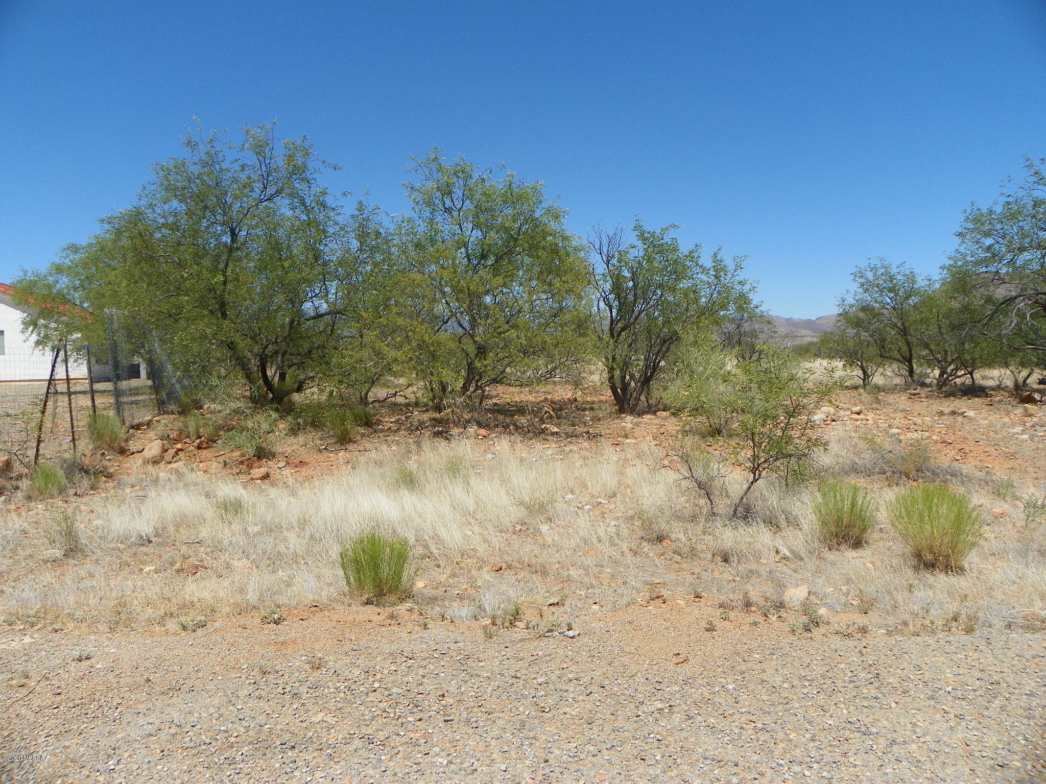 Flat residential lot.  Both electric and water appear to be at the street, water should be verified.  Paved road and only 5 minutes to the Palo Parado exit.