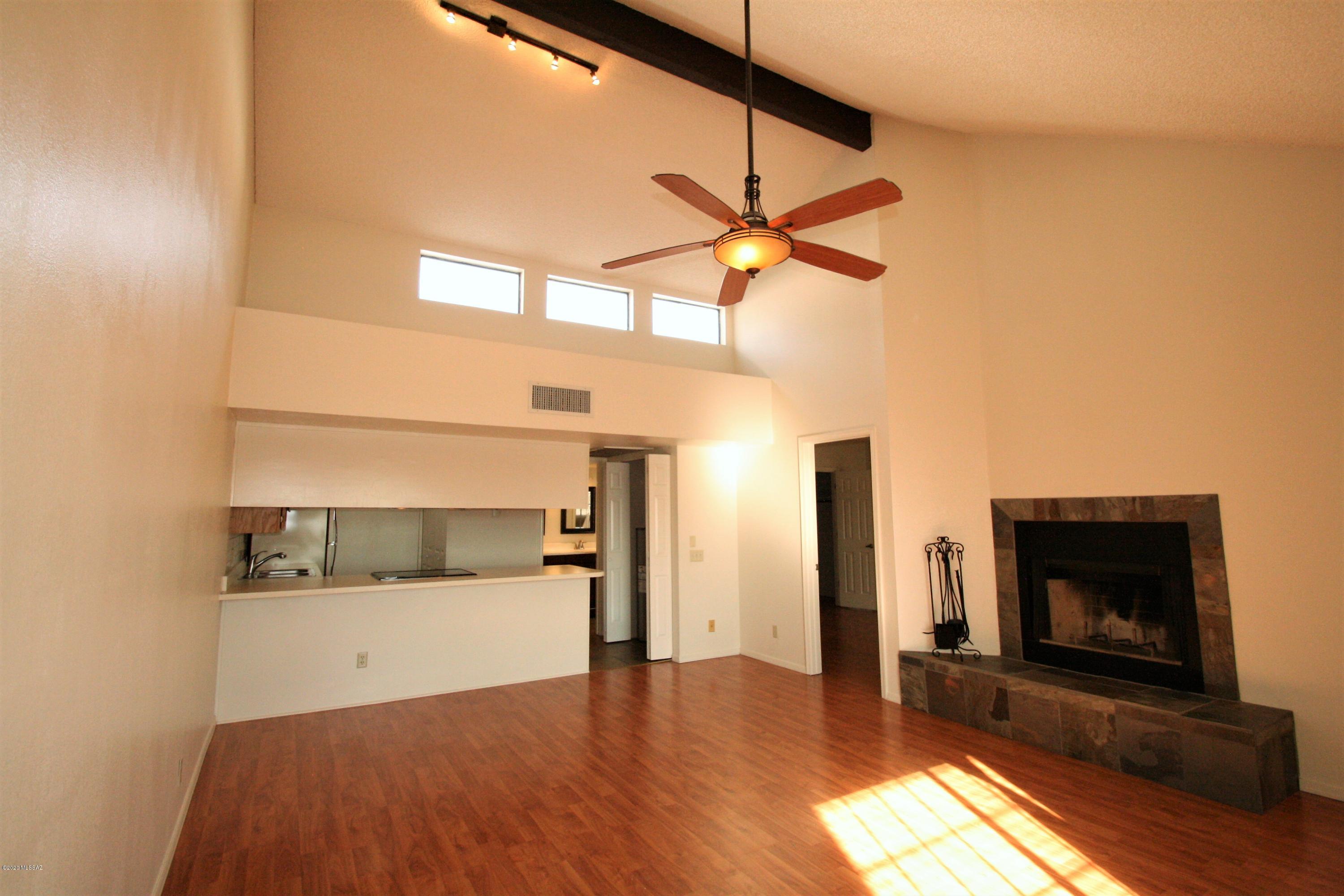 Beautifully maintained, move-in ready condo in a fantastic location, with a great view of the Rillito Park Racetrack from the balcony! Close to UA, Banner Medical Center, farmer's markets, food and entertainment, and easy access to Tucson's LOOP used for cycling, running, and walking. Home owner association fees cover pool, spa, landscaping, external maintenance, recreation center, water, sewer, and trash. One covered parking space is also included.