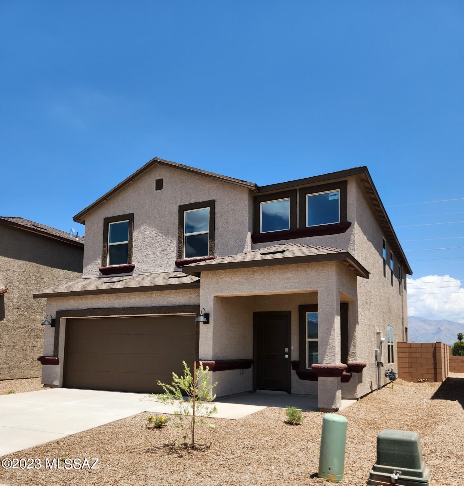 Wide open floor plan in our newest community, Silverbell Crossings. Standard features include Gray cabinetry, Quartz countertops, Stainless gas range, dishwasher, microwave, tankless water heater and much more. Smart home technology package also included