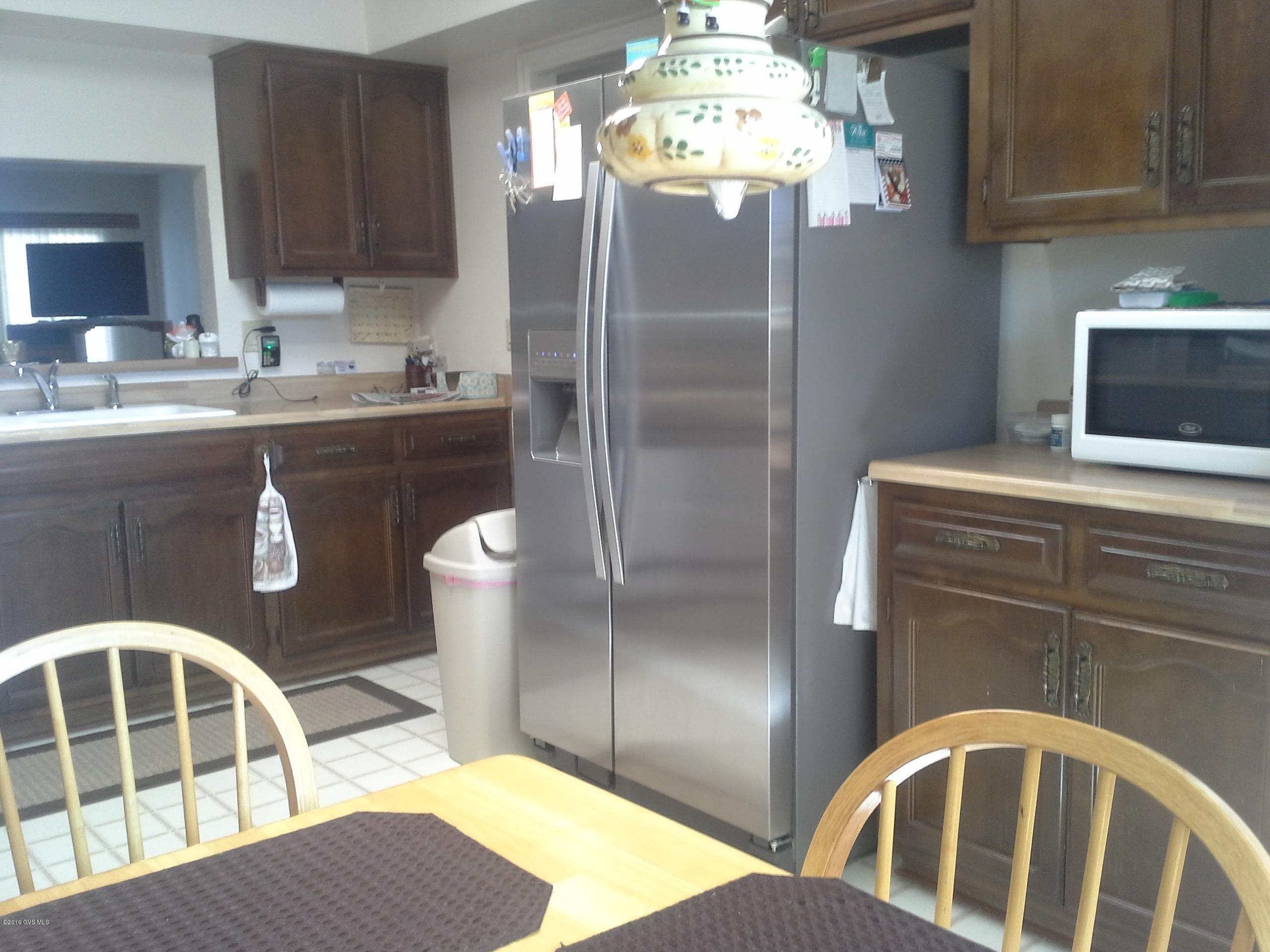 A very clean well maintained home. Large master bedroom, split floor plan, light and bright with skylights. Spacious living room with beehive fireplace. Extended garage for larger vehicles. No GVR but available. Comes with furnishings.