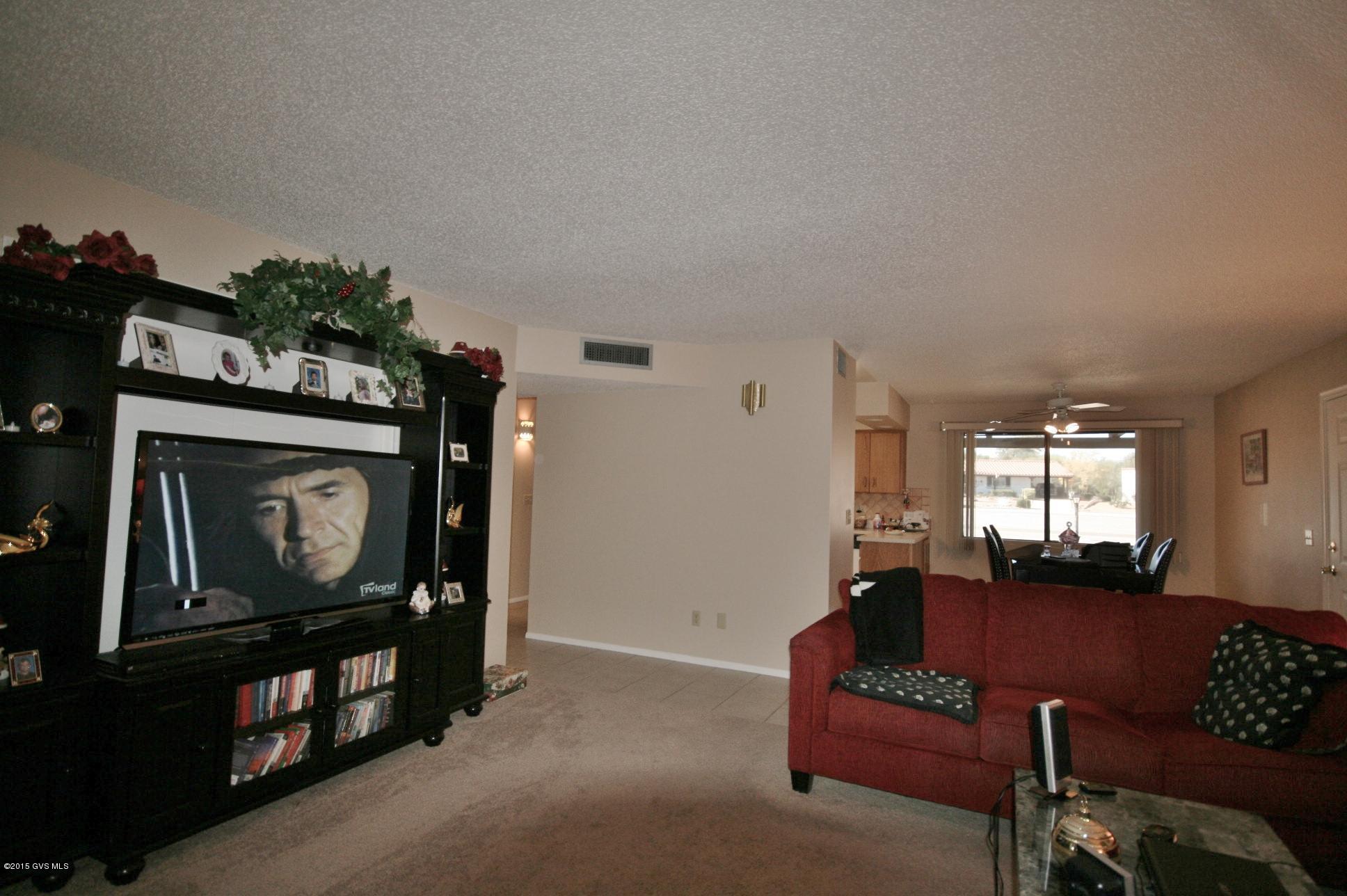 TURN-KEY comfort & convenience with 3 bedrooms, WORKSHOP, year round AZ room & ALL APPLIANCES. Just bring your toothbrush & clothes to move in! This delightful home comes with nearly new carpet, paint, several dual-pane windows & mostly newer furnishings. Conveniently located a few blocks from I-19, shopping, East Side Rec Center and 1 of 7 nearby golf courses, you can relax in your fenced yard, screened porch or patio after a hard day of R&R. Required GV Rec offers 100's of classes in ART, dance, SPORTS, ceramics, WOODWORKING, jewelry, MUSIC, nature studies, COMPUTERS. Freely use all 14 rec centers with pools, spas, sports courts, exercise equipment, movies, etc. 2016 dues $475. Be as active as YOU want with 5 STAR RESORT BENEFITS on a budget even Scrooge would approve.