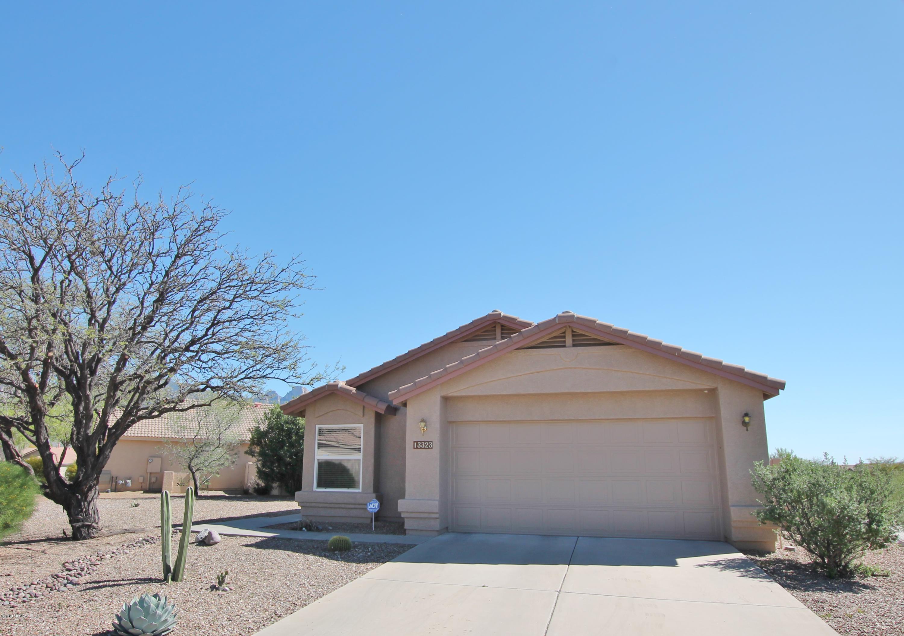 Views of the Catalinas at a fantastic price. This move-in ready Oro Valley home has common area on the side and rear, providing for privacy and views. The exterior has been freshly painted. The open great room floor plan has a solar tube in the dining room to add more natural light. The kitchen features quartz countertops, a gas range, and plenty of storage. New dishwasher in 2018. Tankless water heater, epoxy garage floor, blinds on all windows and much more. Priced to move.