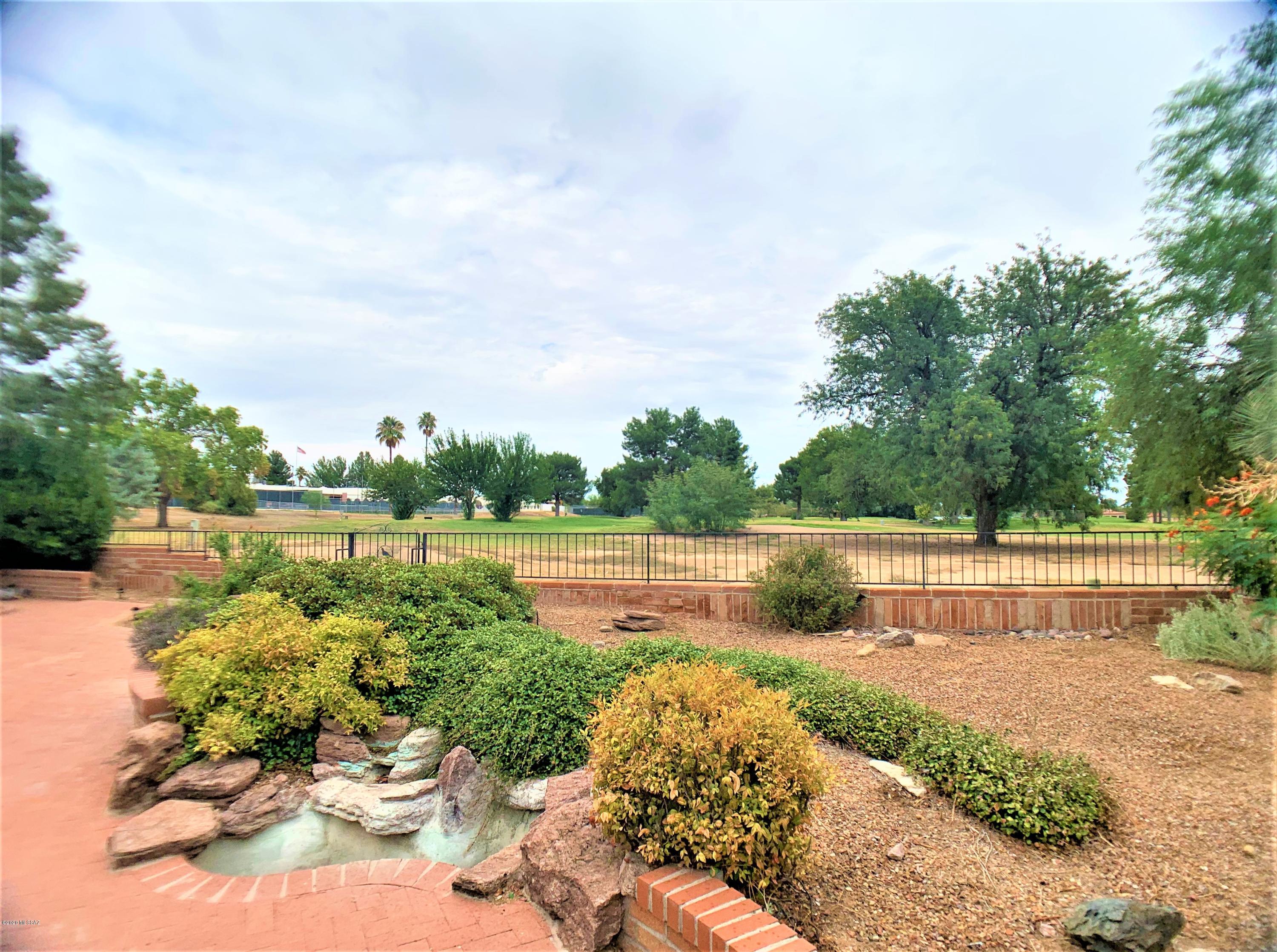 Looking for Golf course views?  Charming 2BD/2BA/DEN + AZ room and 1 Car Carport Home in the heart of Green Valley! With 1297 sqft this home offers a great location with views of Heaven Golf Course. Take advantage of the open floor plan and update to your taste. Tile flooring throughout except bedrooms. Den with closet can easily be converted into 3rd bedroom.  Storage room. The front yard offers mature landscaping while backyard offers tons of space, water feature and Golf course views. This can be your winter retreat or your home year around. Age restricted 55 + and GVR membership. DESIRABLE LOW HOA. Great quiet location with short distance to East GVR center. Easy access to 1-19 and close to shopping and restaurants.